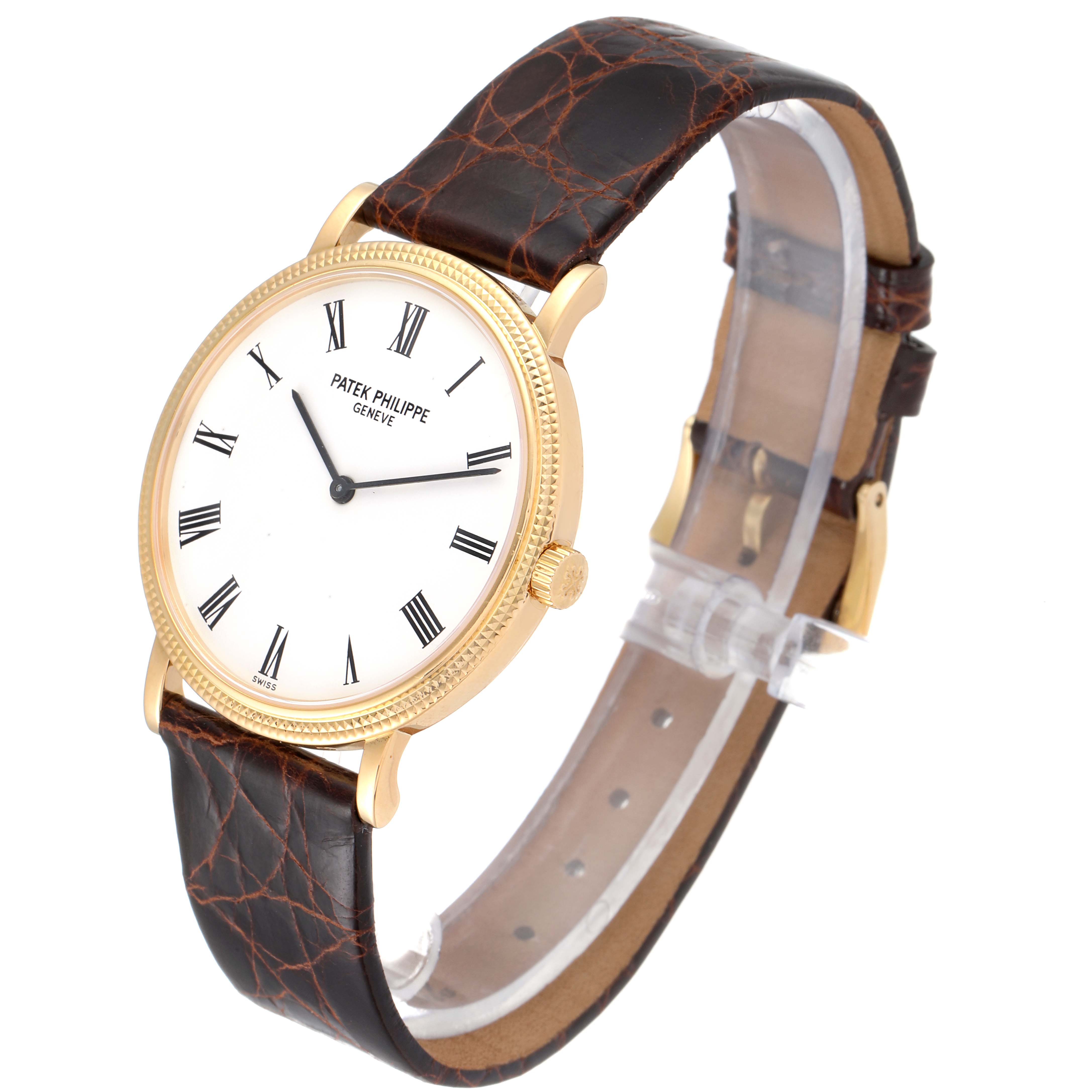 The image shows a Patek Philippe Calatrava 5120J Men's Yellow Gold White Dial 5120J Men's Yellow Gold White Dial watch at a slight angle, featuring a white dial, Roman numerals, and a brown leather strap.