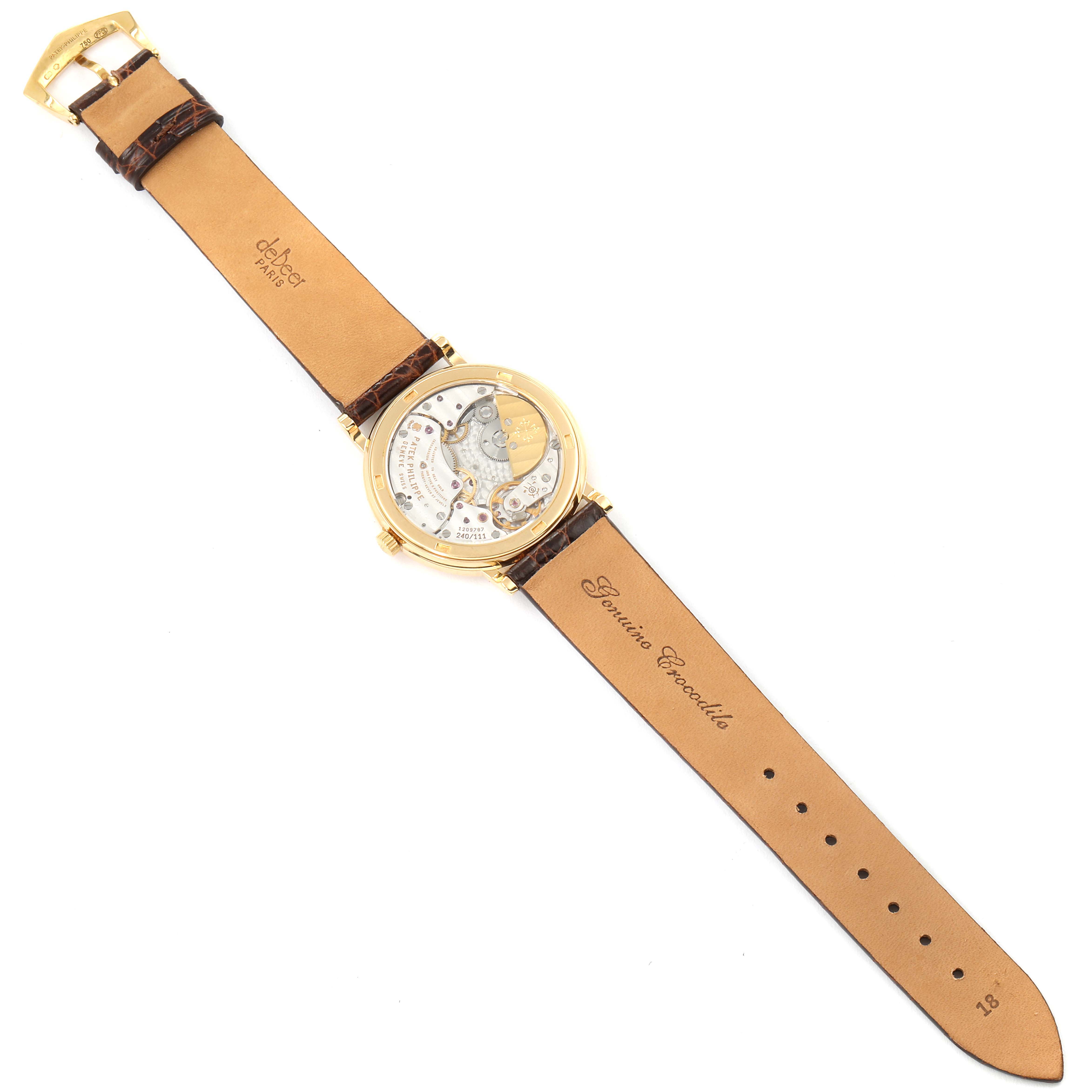 The image shows the back view of a Patek Philippe Calatrava 5120J Men's Yellow Gold White Dial 5120J Men's Yellow Gold White Dial watch, showcasing its movement and leather strap.