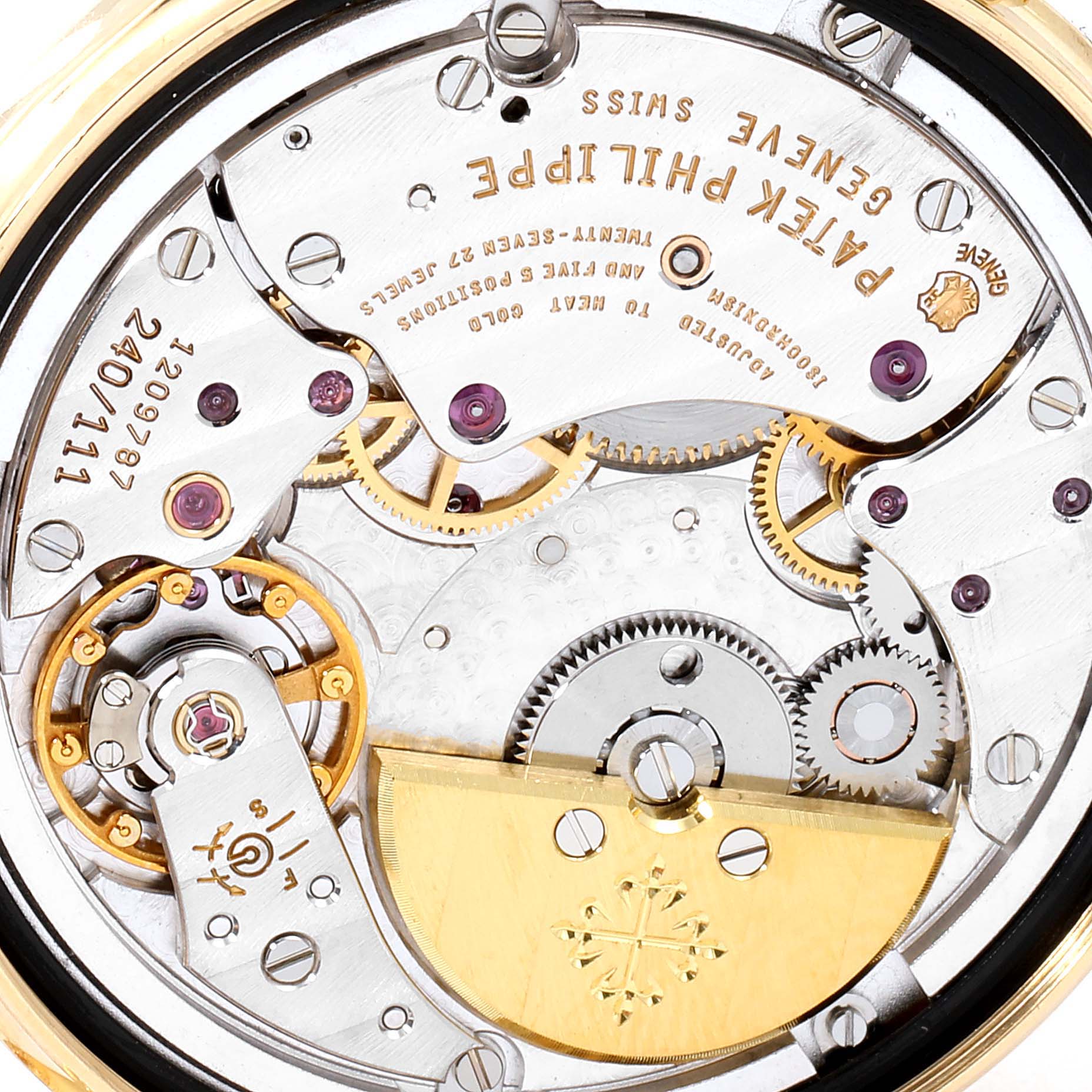 This image shows the intricate movement and internal mechanisms of a Patek Philippe Calatrava 5120J Men's Yellow Gold White Dial 5120J Men's Yellow Gold White Dial watch, viewed from the back.