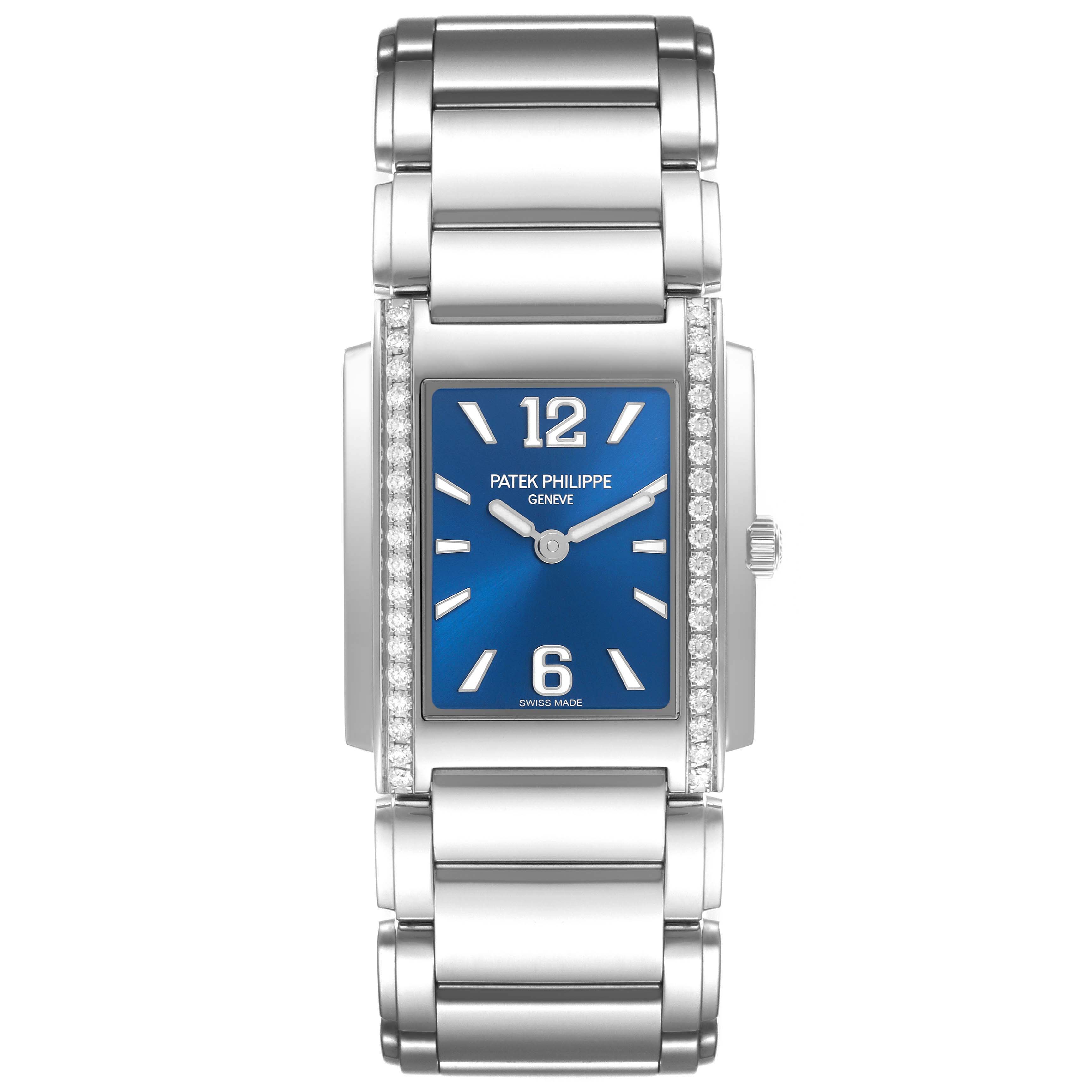 The Patek Philippe Twenty-4 4910/1200A-001 Women's Stainless Steel Blue Dial 4910/1200A-001 Women's Stainless Steel Blue Dial watch is shown from a front angle, highlighting its blue rectangular dial, stainless steel bracelet, and diamond-set bezel.