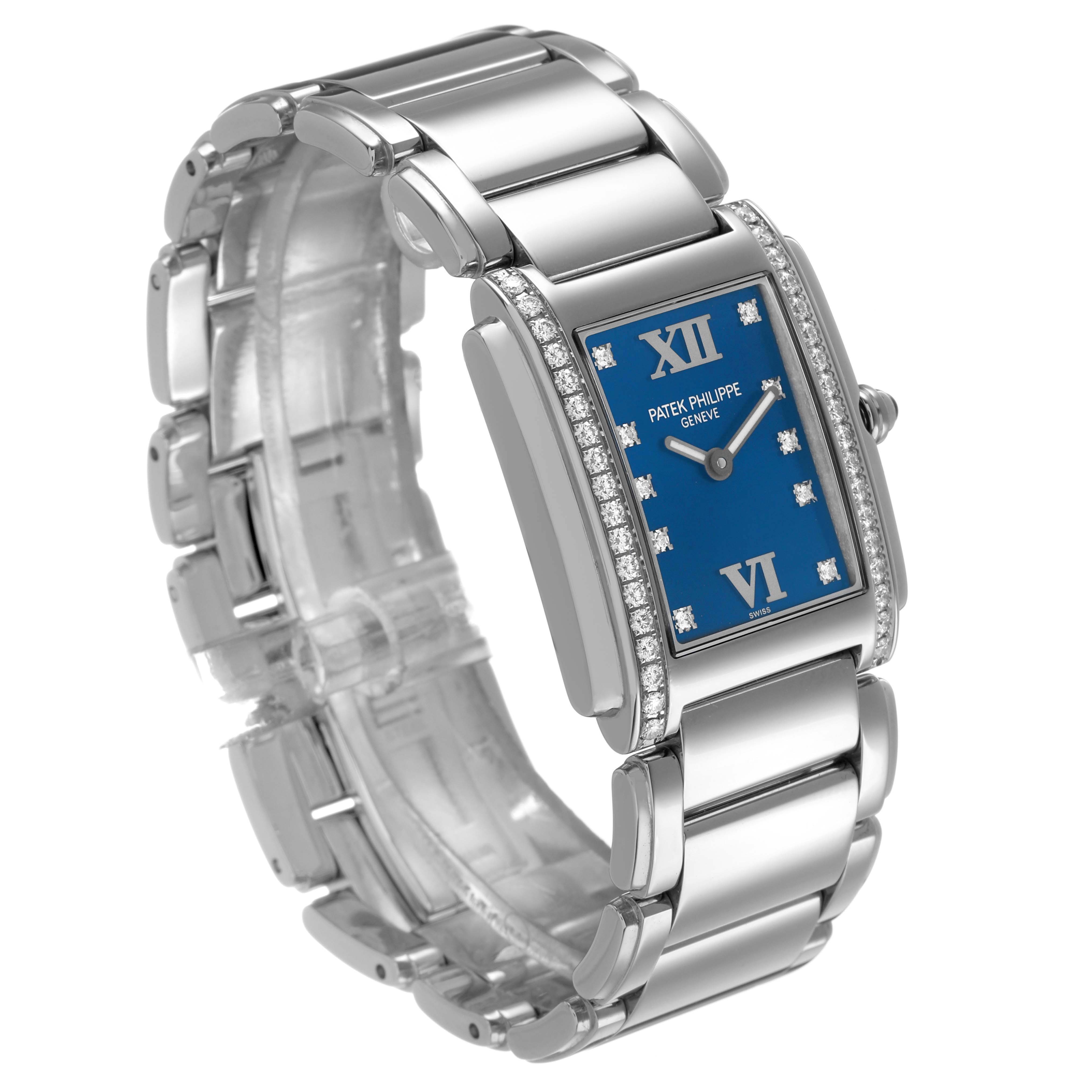 The Patek Philippe Twenty-4 4910/10A Women's Stainless Steel Blue Dial watch is shown at an angled side view, revealing the bracelet, blue dial, and diamond-set bezel.