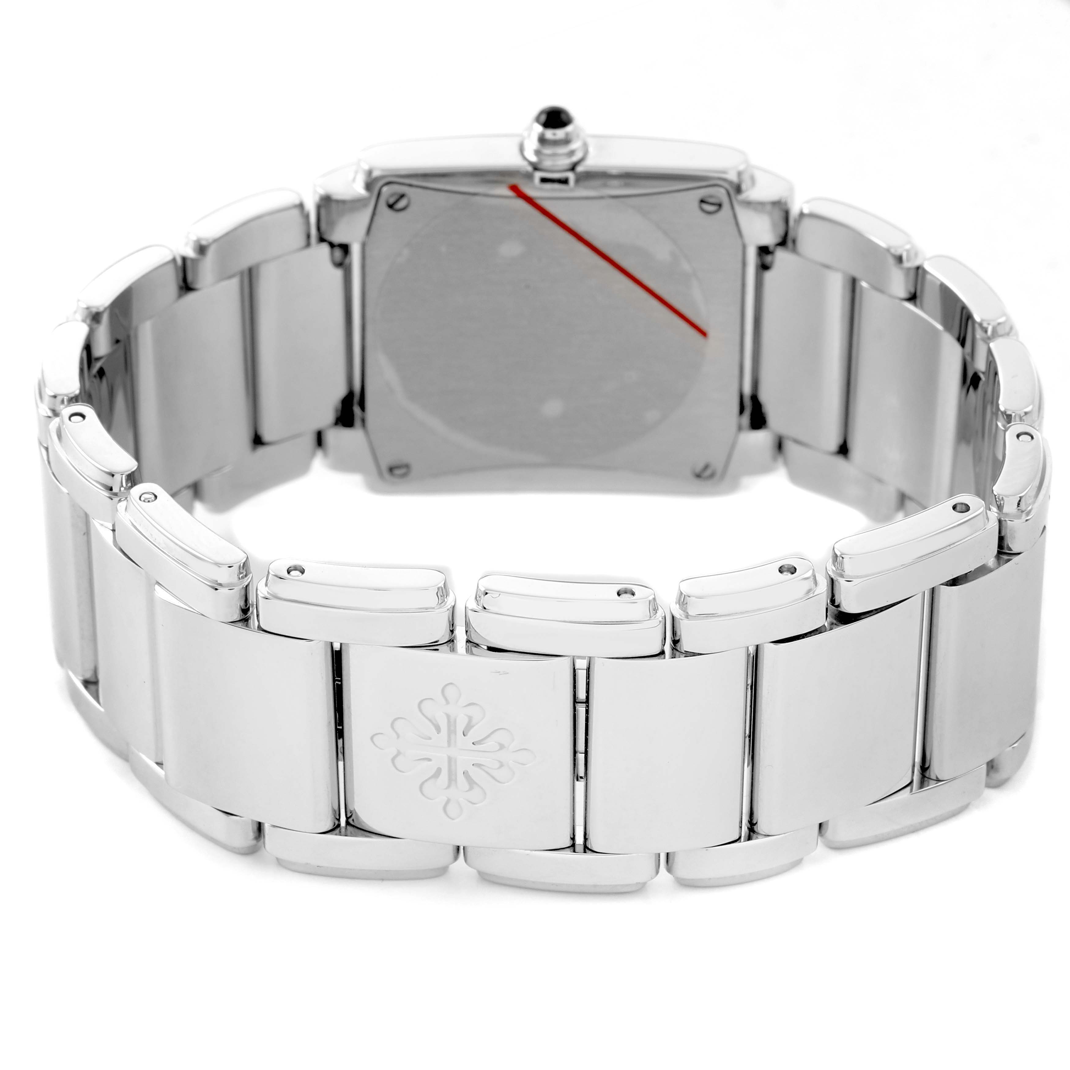 The Patek Philippe Twenty-4 4910/10A Women's Stainless Steel Blue Dial watch is shown from the back, displaying the clasp and bracelet links.