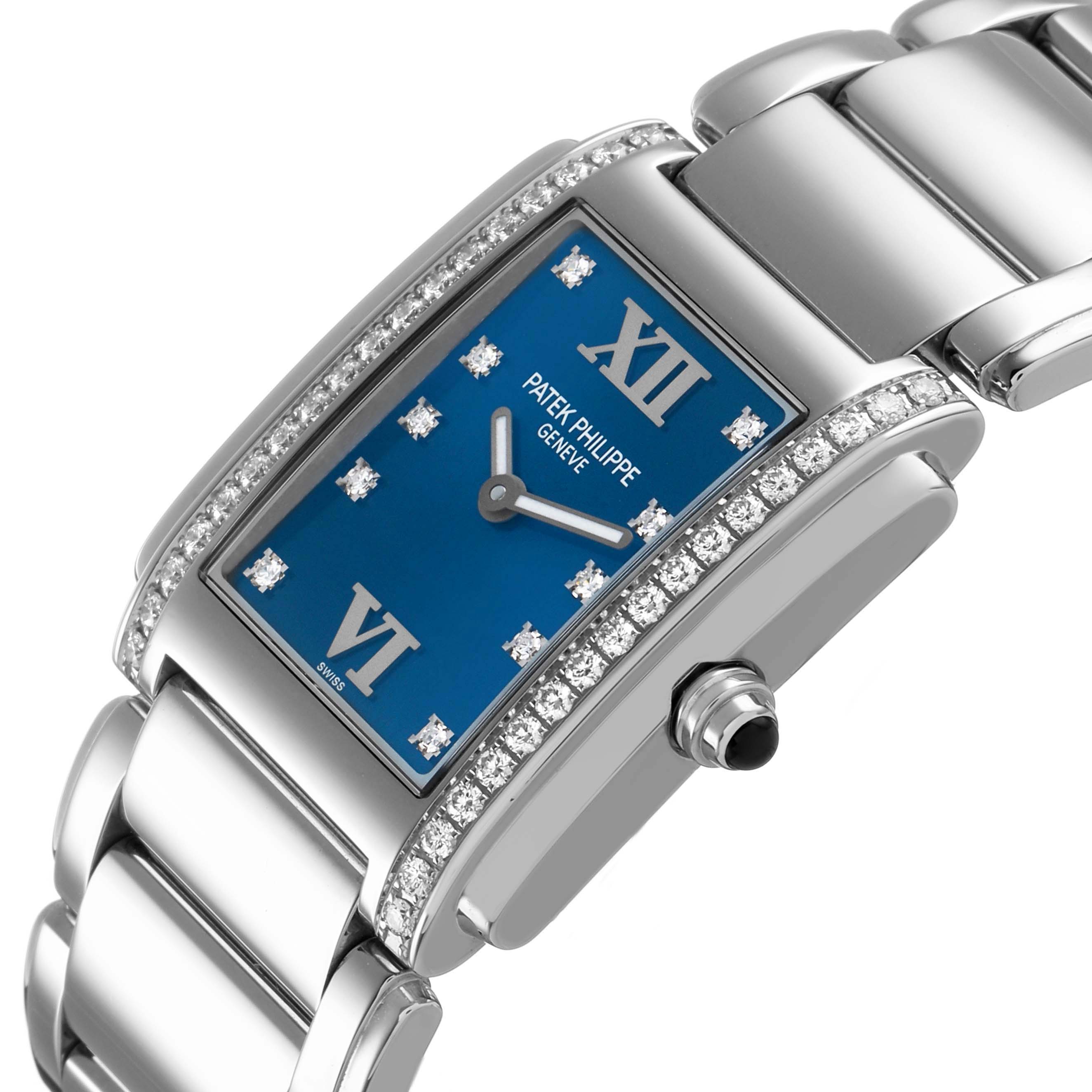 The Patek Philippe Twenty-4 4910/10A Women's Stainless Steel Blue Dial watch is shown at an angle highlighting the blue dial, Roman numerals, diamond bezel, and bracelet.