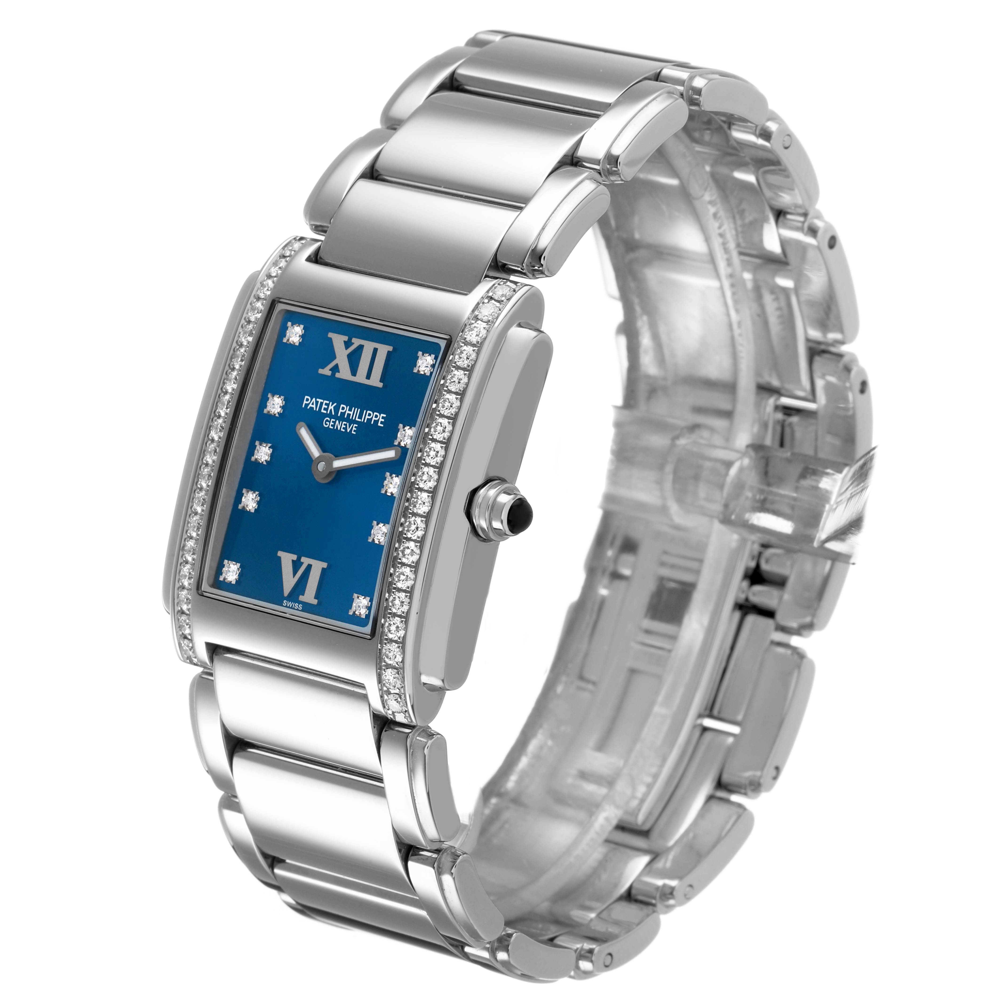 The Patek Philippe Twenty-4 4910/10A Women's Stainless Steel Blue Dial watch is shown at a slight angle highlighting the face, bezel, bracelet, and crown.