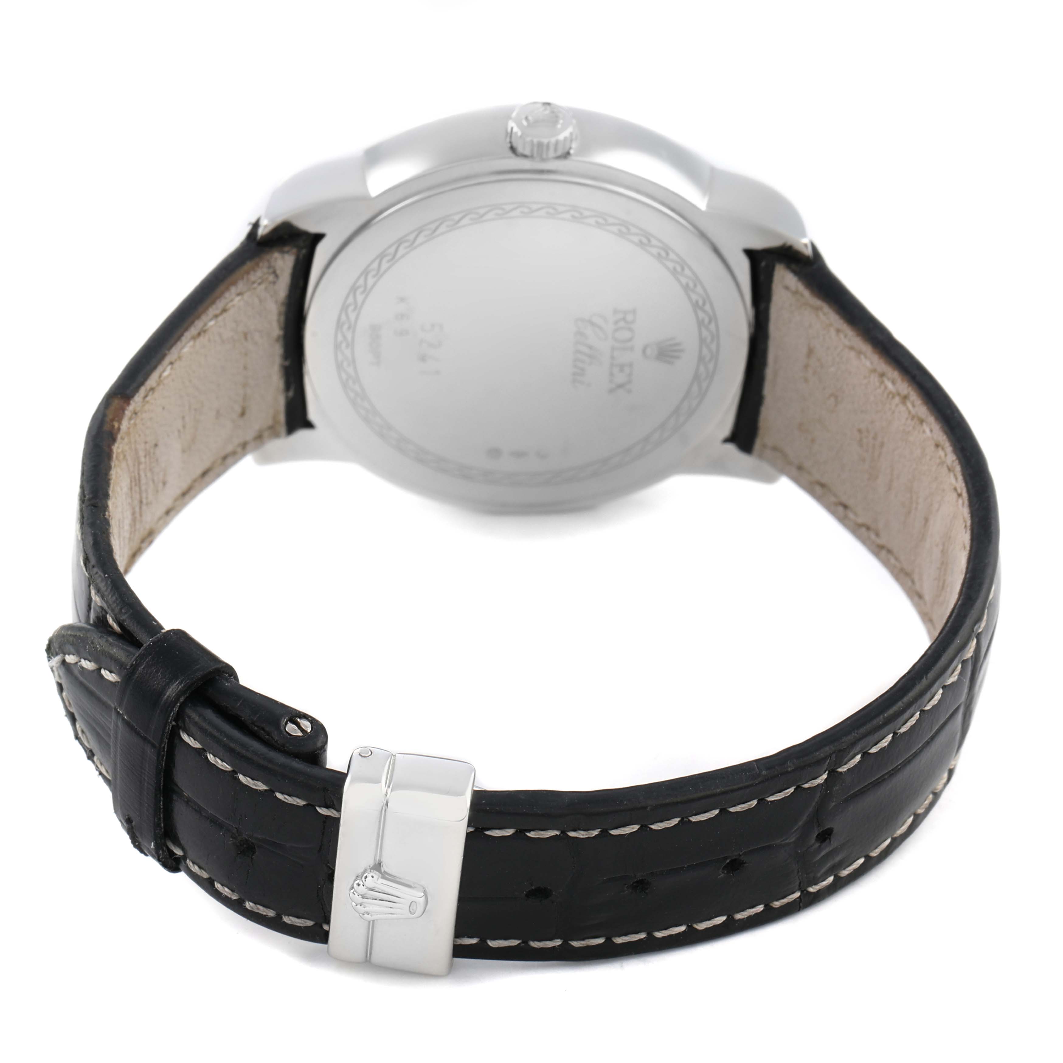 The Rolex Cellini 5241/6 Men's Platinum Black Dial watch is shown from the rear angle, featuring the back case, crown, and leather strap with stitching.