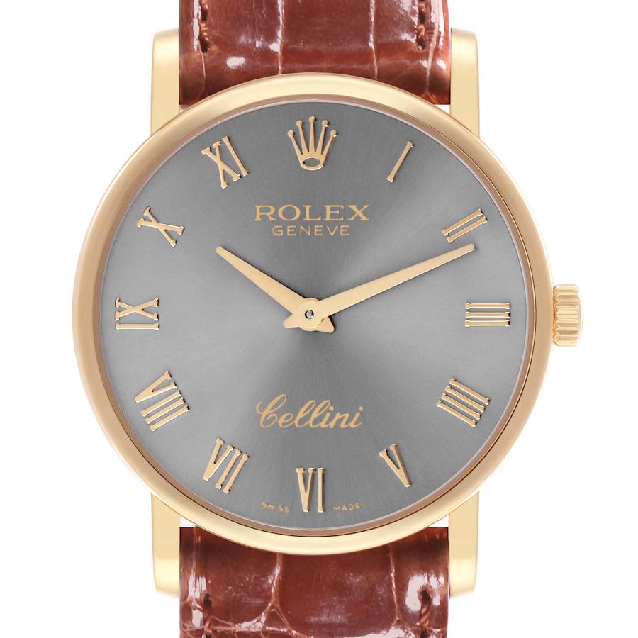 The image shows a front view of the Rolex Cellini watch, highlighting the dial, gold case, and brown leather strap.