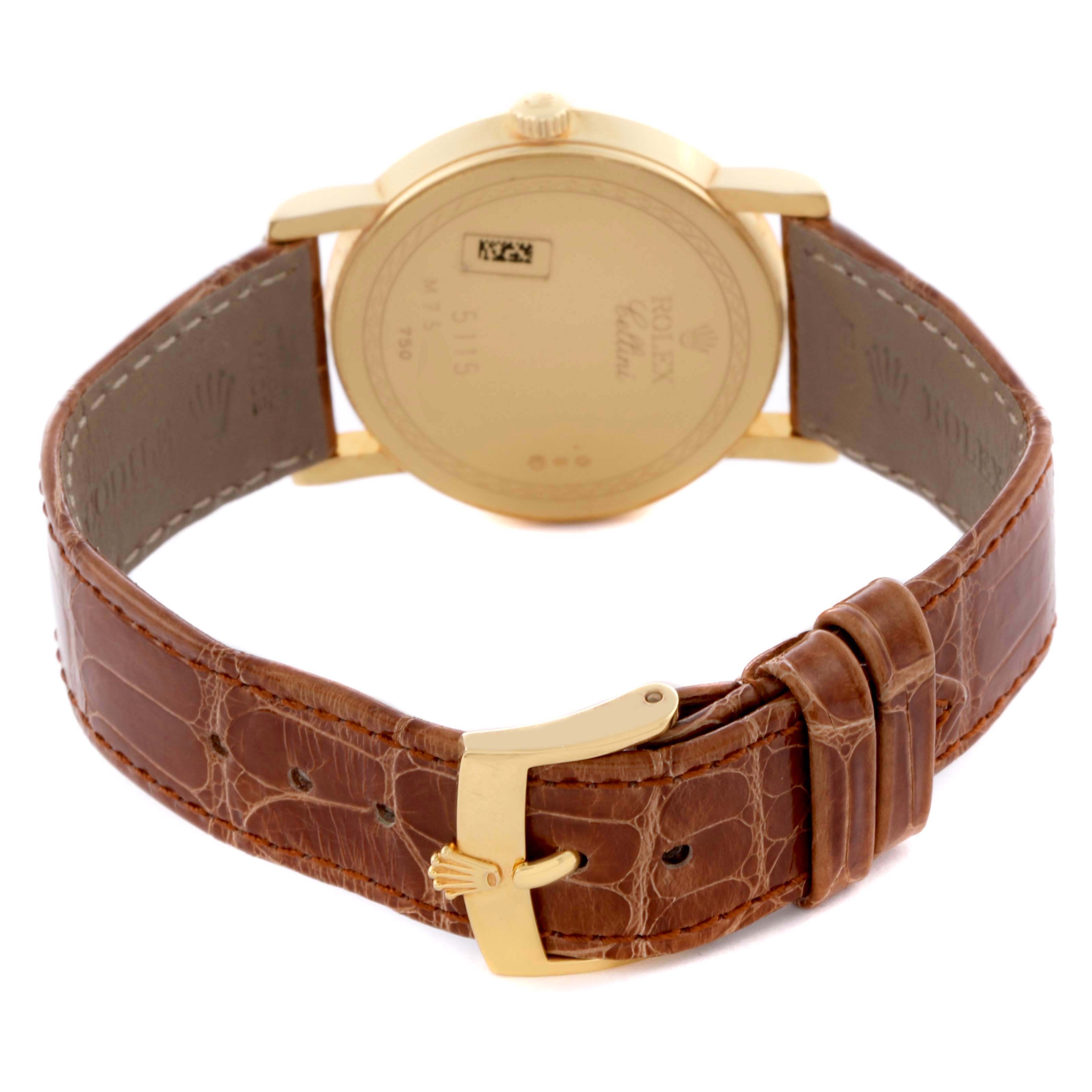 The Rolex Cellini 5115 Men's Yellow Gold Grey Dial 5115 Men's Yellow Gold Grey Dial watch is shown from the back, highlighting the case, brown leather strap, and gold buckle.
