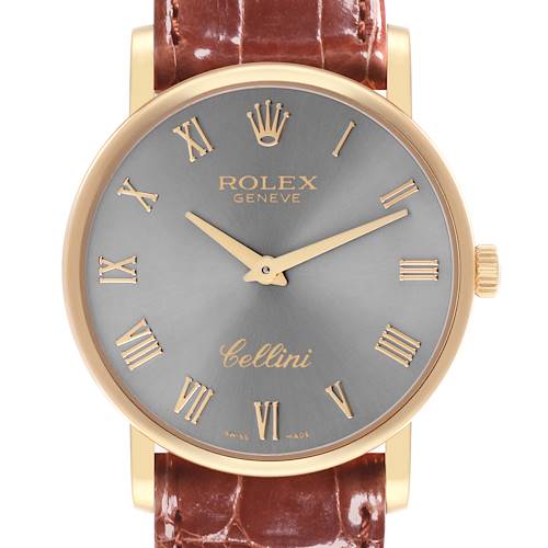 The Rolex Cellini watch is shown from the front, displaying the dial, hands, crown, and leather strap.