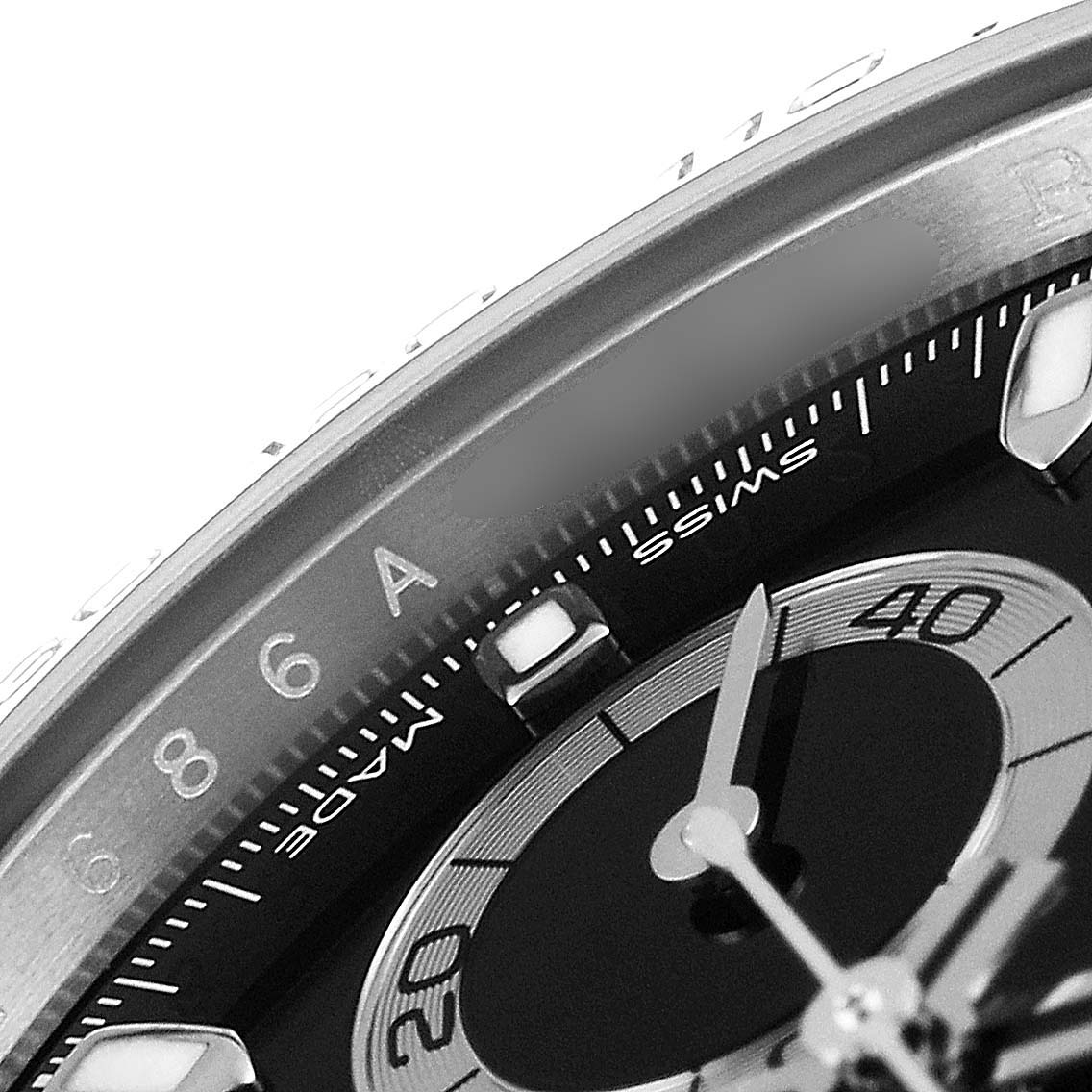 Close-up of the Rolex Daytona 116500 Men
s Stainless Steel Black Dial 116500 Men
s Stainless Steel Black Dial watch shows a portion of the bezel, dial, and part of the subdial.