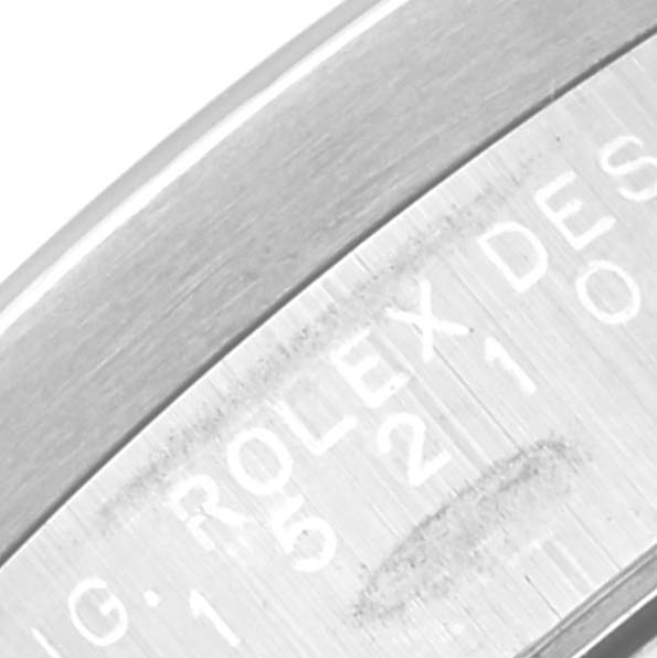 This close-up image shows the engraved text on the inner bezel of a Rolex Date 15210 Men's Stainless Steel Blue Dial 15210 Men's Stainless Steel Blue Dial model watch.
