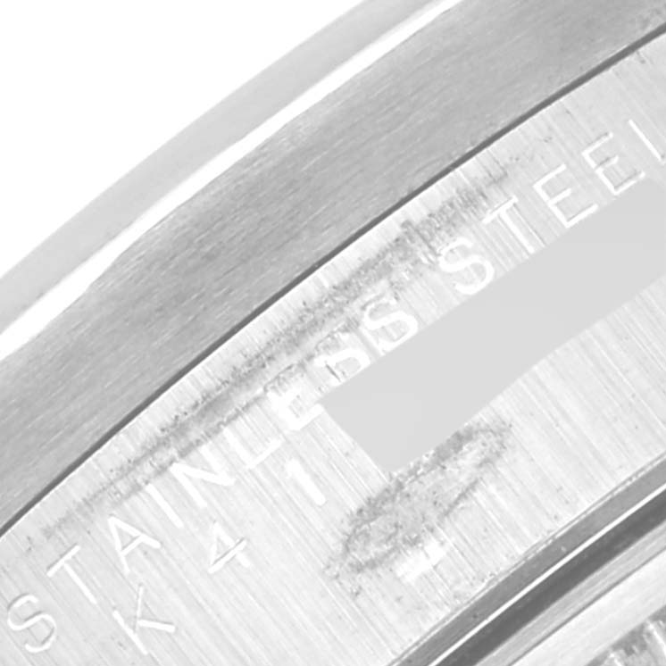 This image shows a close-up of the engraved text on the case back of a Rolex Date 15210 Men's Stainless Steel Blue Dial 15210 Men's Stainless Steel Blue Dial model watch, highlighting the "STAINLESS STEEL" mark.