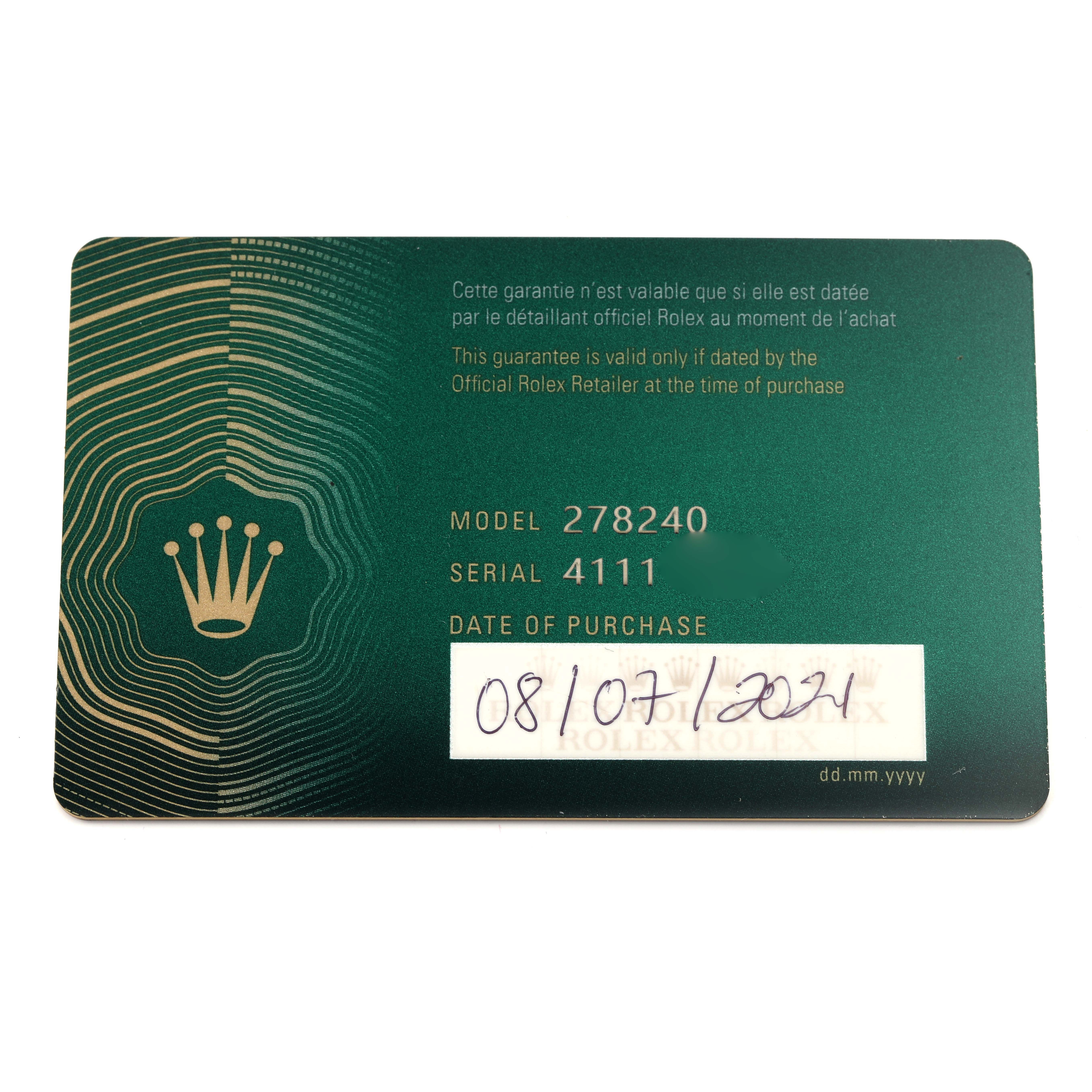 The image shows a green warranty card for the Rolex Datejust model, displaying model and serial numbers as well as the purchase date.