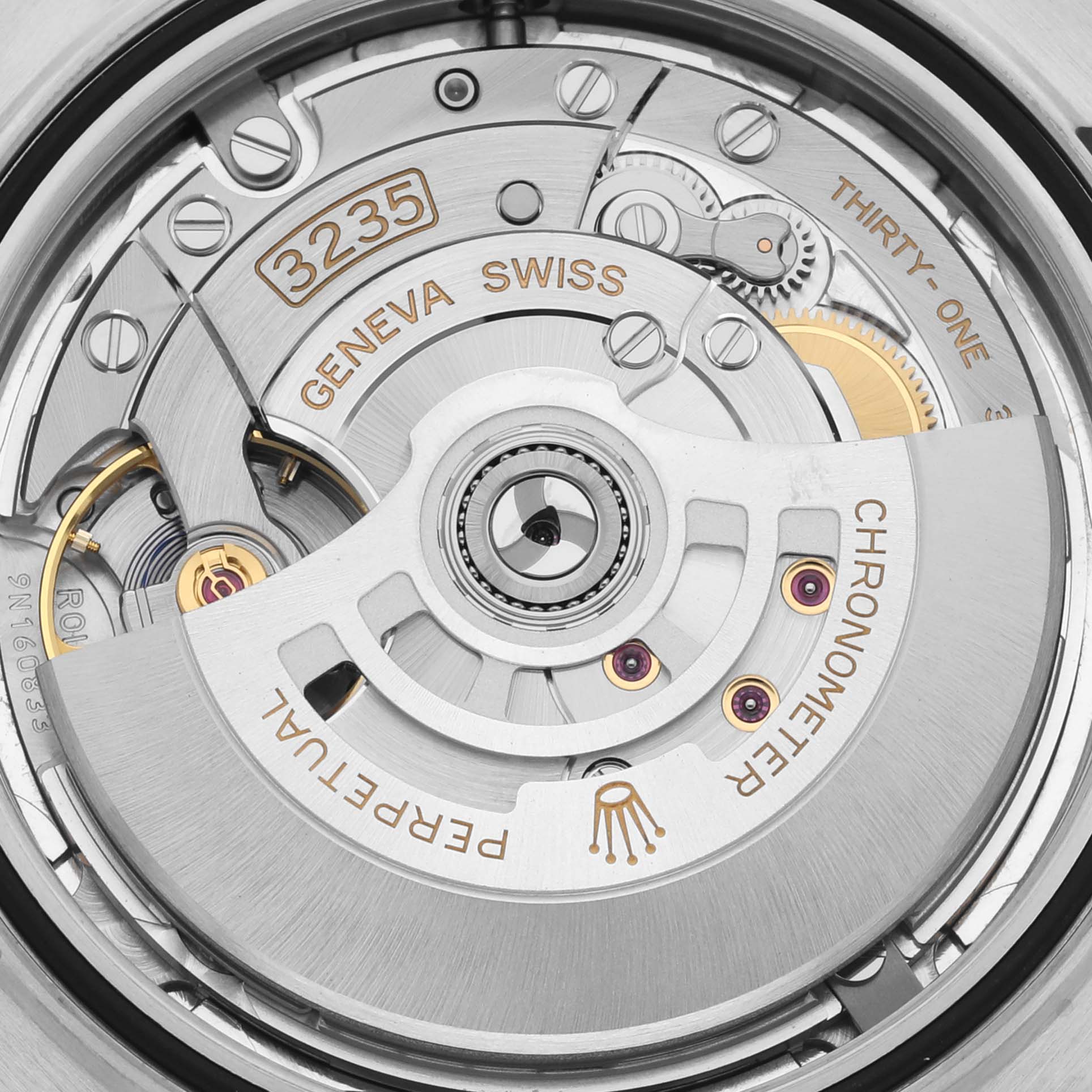 The image shows the movement of a Rolex Datejust 41 126331 Men's Steel and Gold (two tone) Pink Dial 126331 Men's Steel and Gold (two tone) Pink Dial, highlighting components like the rotor and gears from a top-down angle.