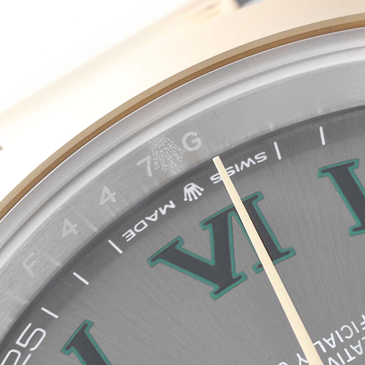 The image shows a close-up of the dial's edge and bezel of a Rolex Datejust 41 126303 Men's Steel and Gold (two tone) Grey Dial, highlighting the Roman numeral VI and "Swiss Made."