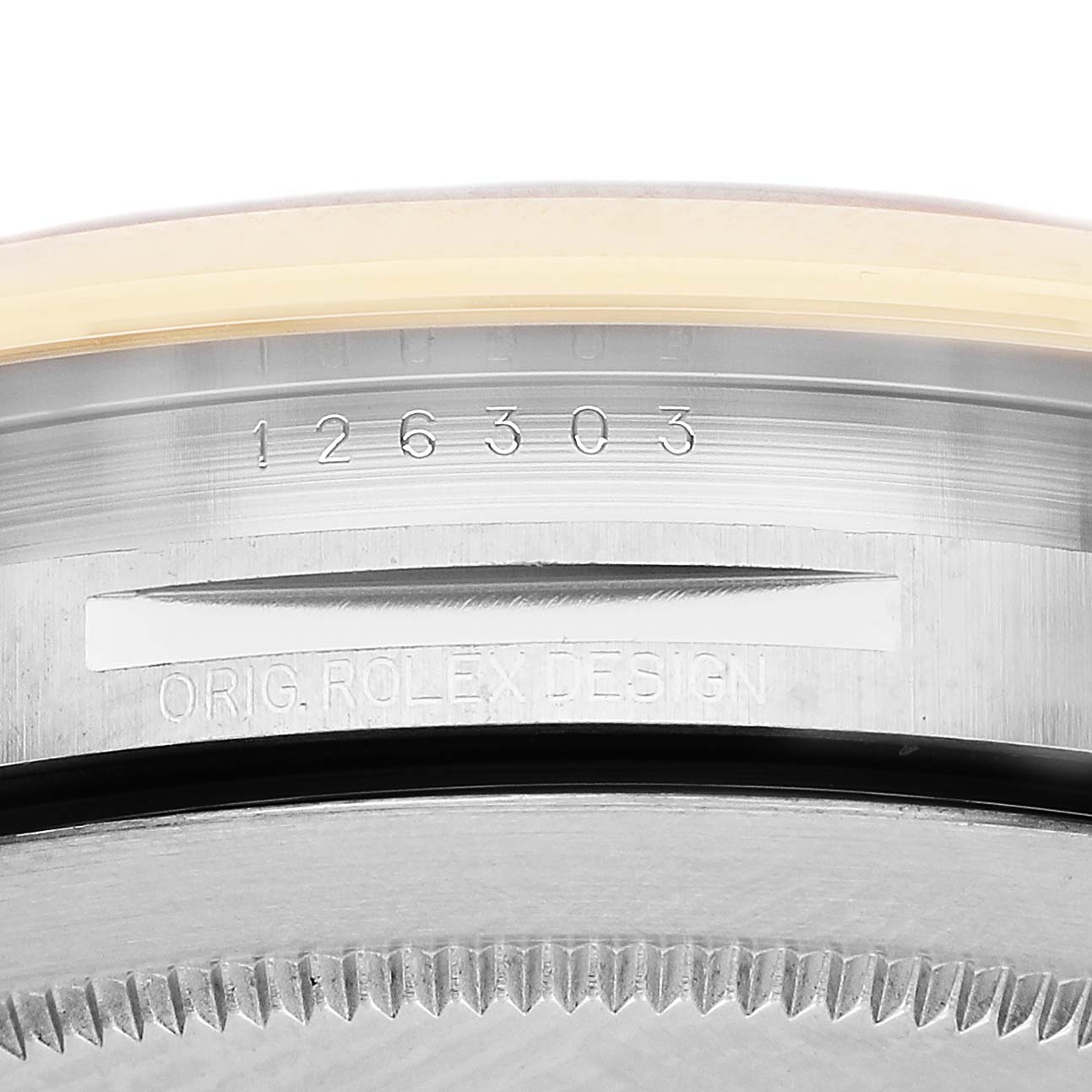The image shows the serial and design numbers on the case side of a Rolex Datejust 41 126303 Men's Steel and Gold (two tone) Grey Dial, viewed at an extreme close-up angle.