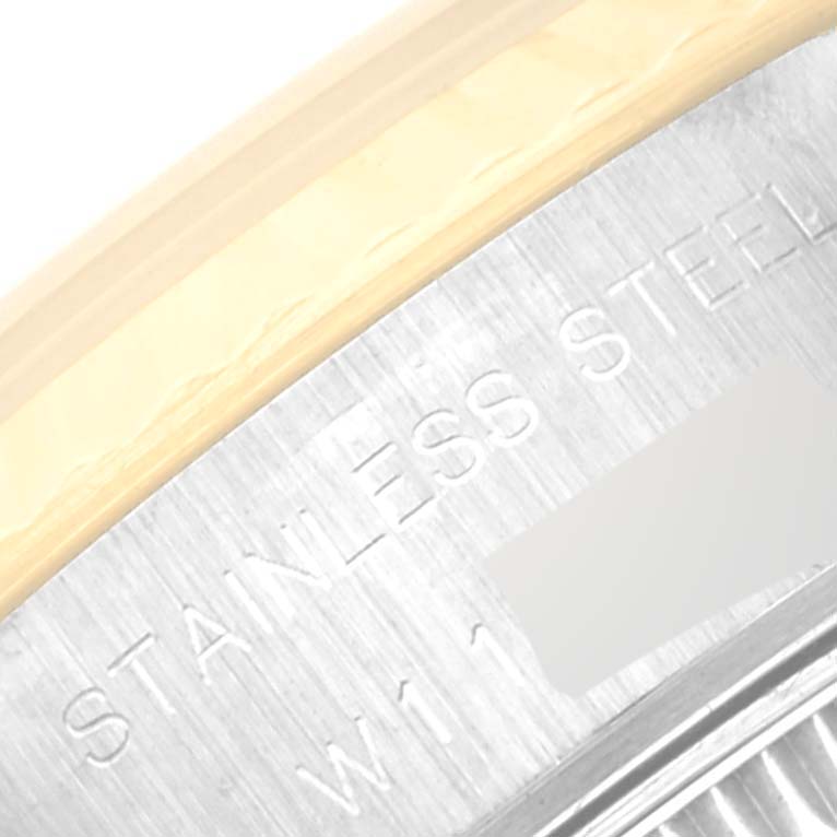 The image shows a close-up of the case back and part of the clasp of a Rolex Datejust 69173 Women's Steel and Gold (two tone) Champagne Dial 69173 Women's Steel and Gold (two tone) Champagne Dial watch, highlighting "Stainless Steel" engraving.