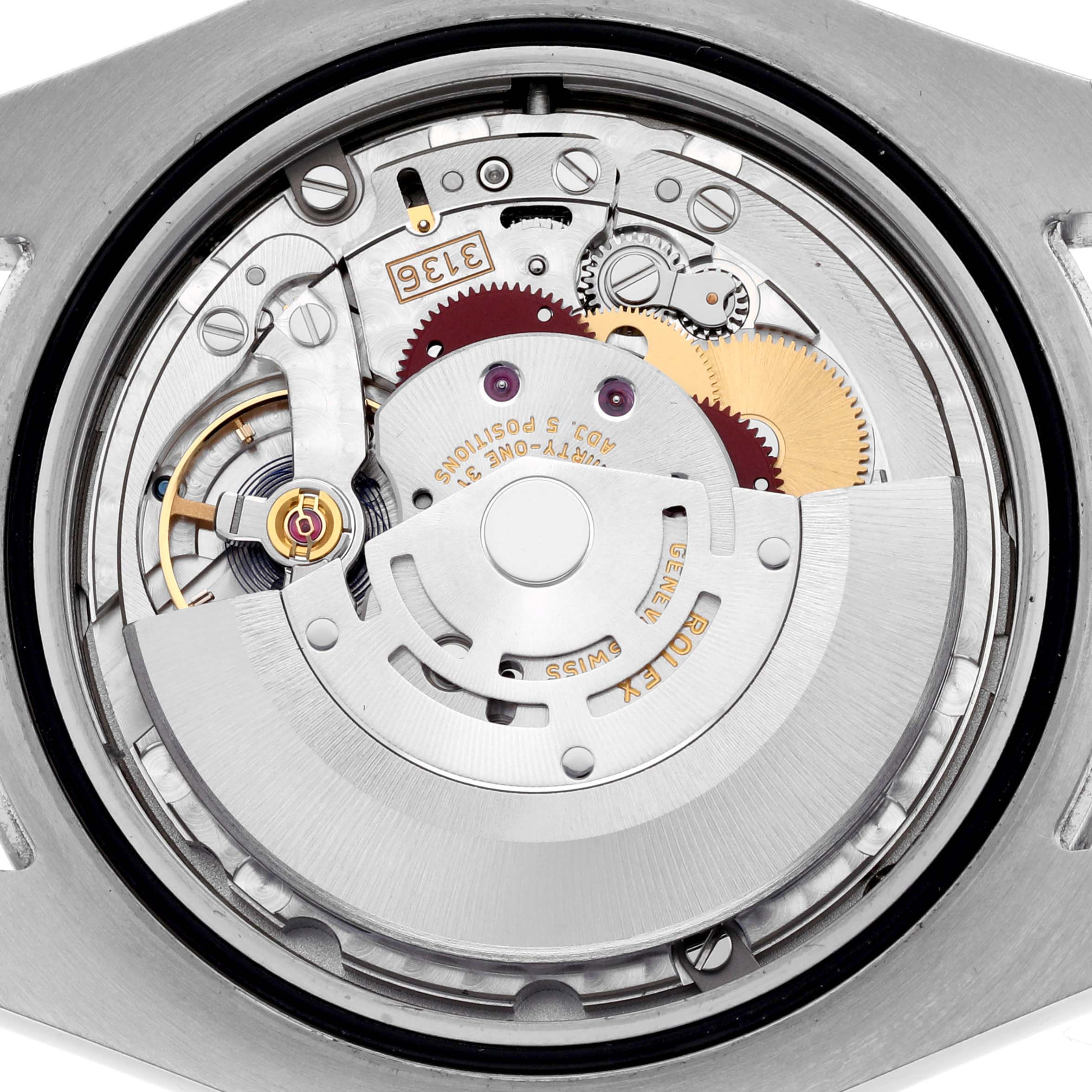 The image shows the internal movement of a Rolex Datejust 41 116300 Men
s Stainless Steel Silver Dial 116300 Men
s Stainless Steel Silver Dial watch, focusing on gears and the rotor from the back.