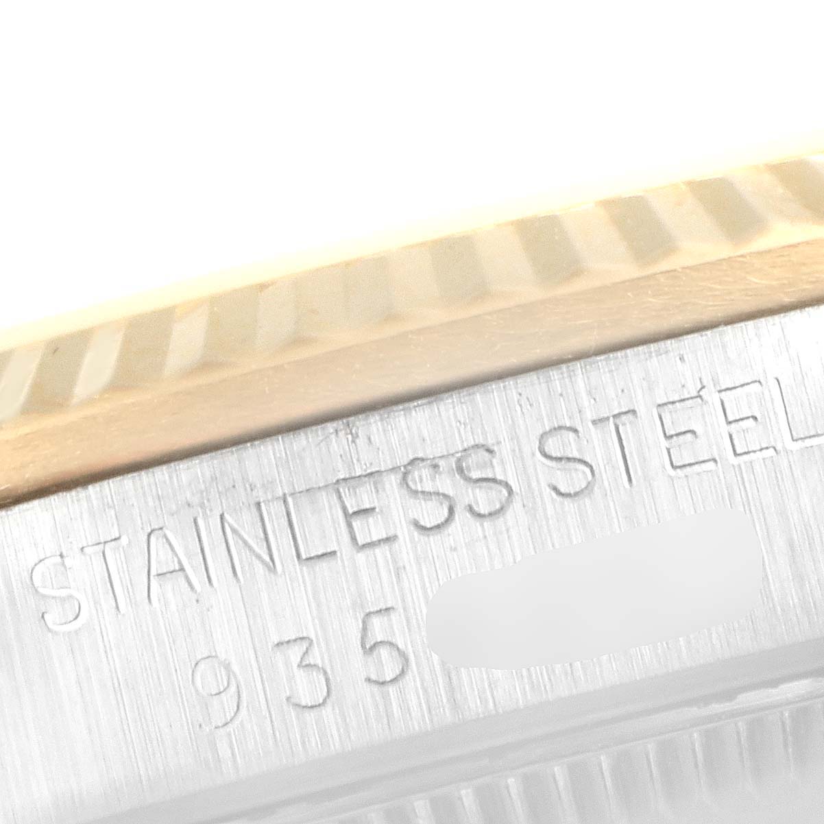 This close-up image shows the stainless steel case and part of the fluted bezel of the Rolex Datejust 68273 Women's Steel and Gold (two tone) White Dial 68273 Women's Steel and Gold (two tone) White Dial model.