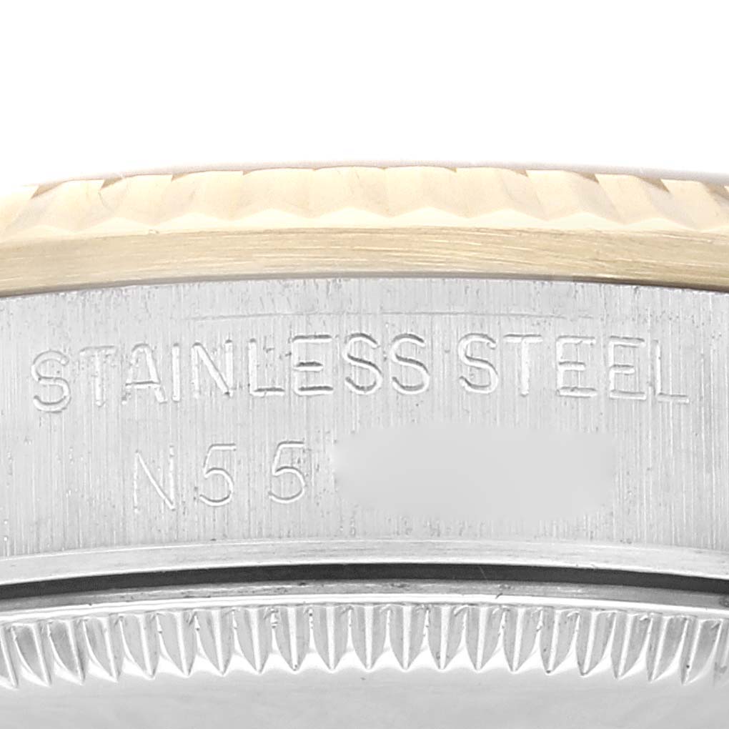 The image shows the side view of the bezel and casing with engravings on the Mid-Size Rolex watch.