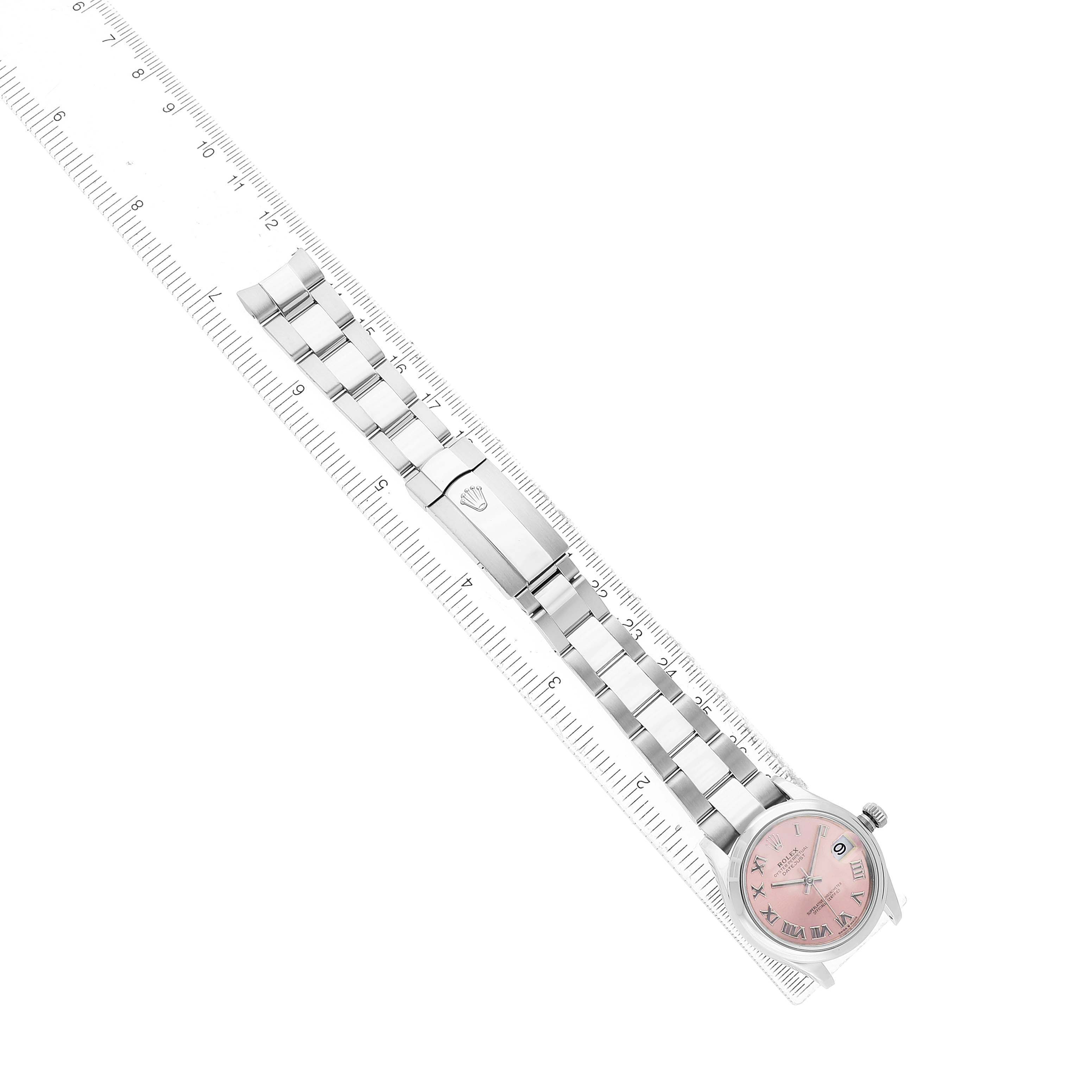 The image shows a Rolex Datejust 278240 Women's Stainless Steel Pink Dial watch laid flat with its bracelet extended along a ruler for measurement.