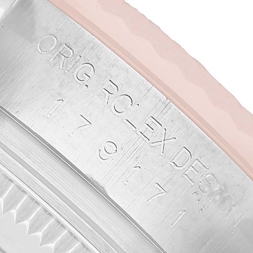 The image shows the engraved side of the bezel on a Rolex Datejust 179171 Women's Steel and Gold (two tone) White Dial watch, highlighting its serial numbers.