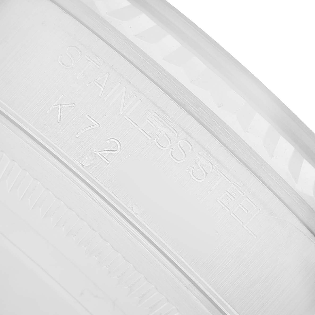 The image shows a close-up of the side of a Rolex Datejust 16234 Men's Stainless Steel Silver Dial watch, highlighting "STAINLESS STEEL" and "K72" engravings.