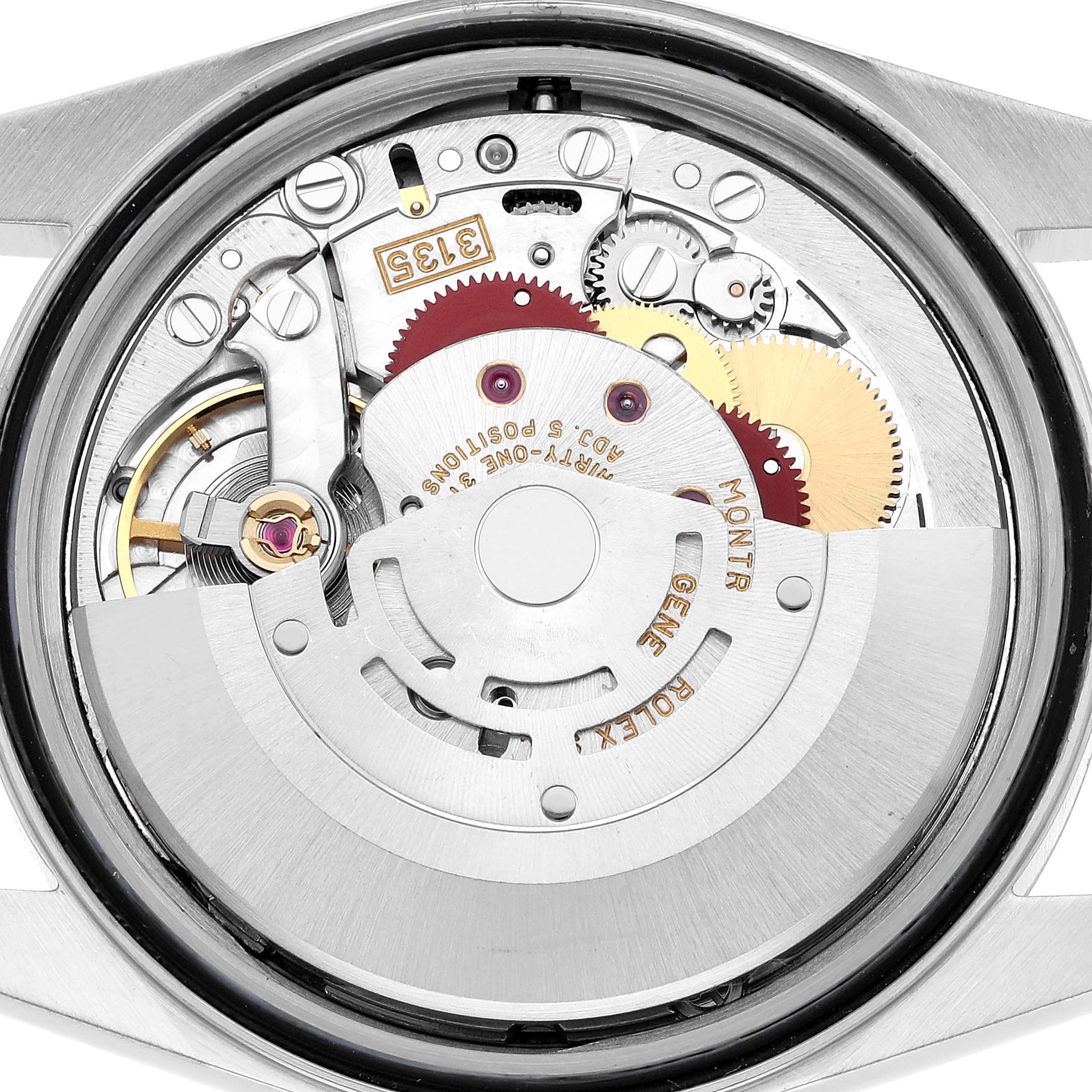 The image shows the movement of a Rolex Datejust 16234 Men's Stainless Steel Silver Dial watch from a back angle, highlighting gears and the rotor.