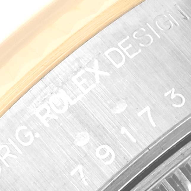 This image shows a close-up of the case back of a Rolex Datejust 79173G Women's Steel and Gold (two tone) Champagne Dial 79173G Women's Steel and Gold (two tone) Champagne Dial, highlighting part of the engraving.