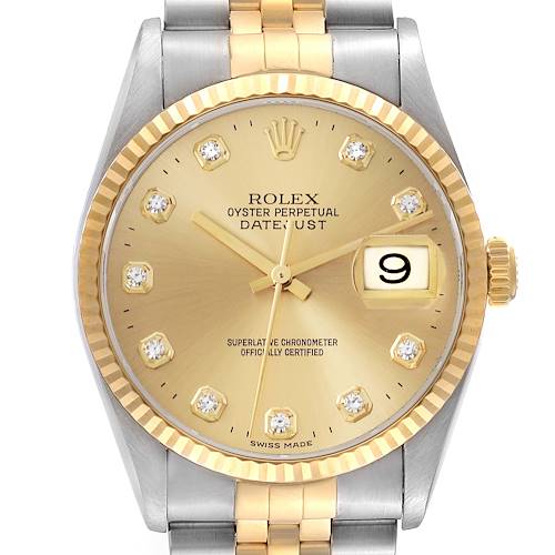 The image shows a Rolex Datejust watch from a frontal angle, highlighting the gold dial, fluted bezel, and Jubilee bracelet.