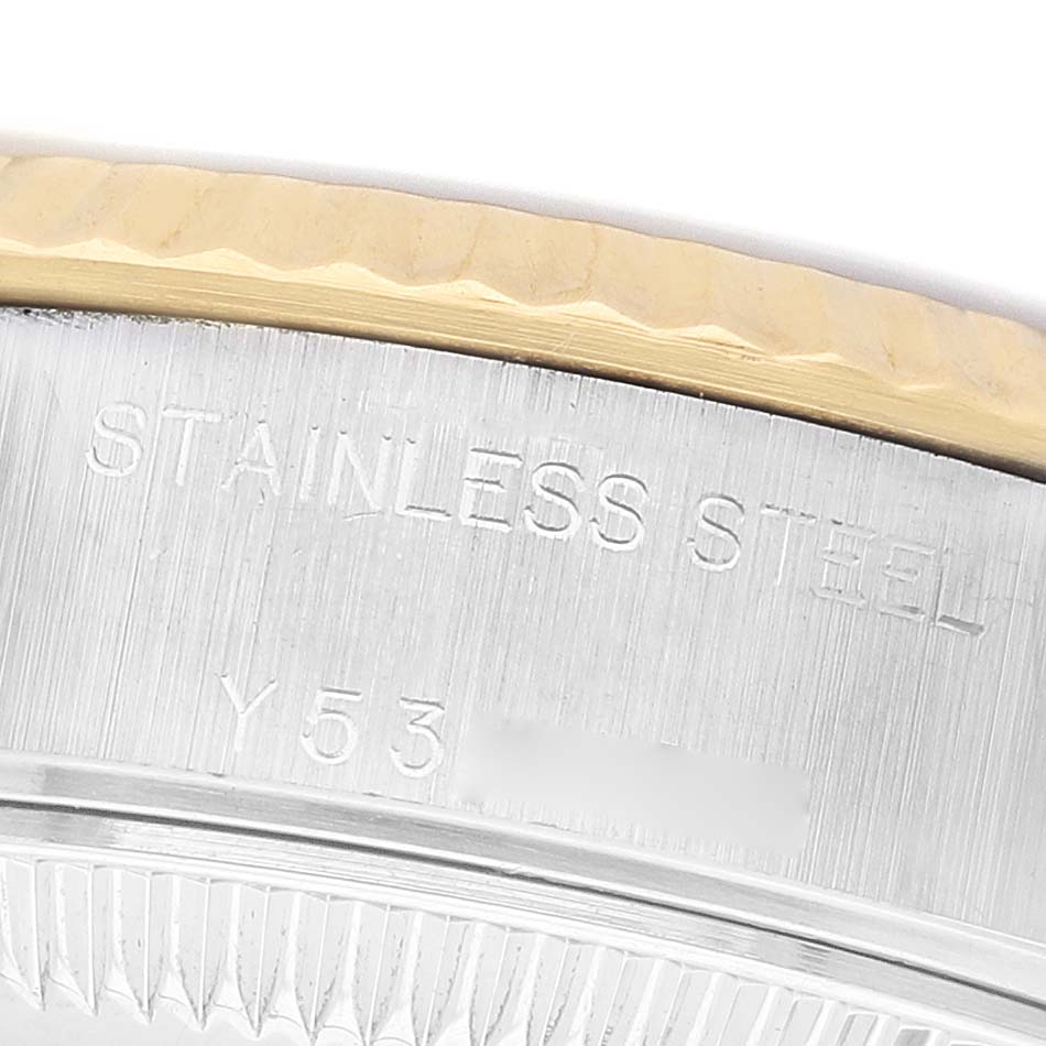 The image shows a close-up of the side of a Rolex Datejust 79173 Women's Steel and Gold (two tone) Beige Dial, highlighting the stainless steel and gold bezel.