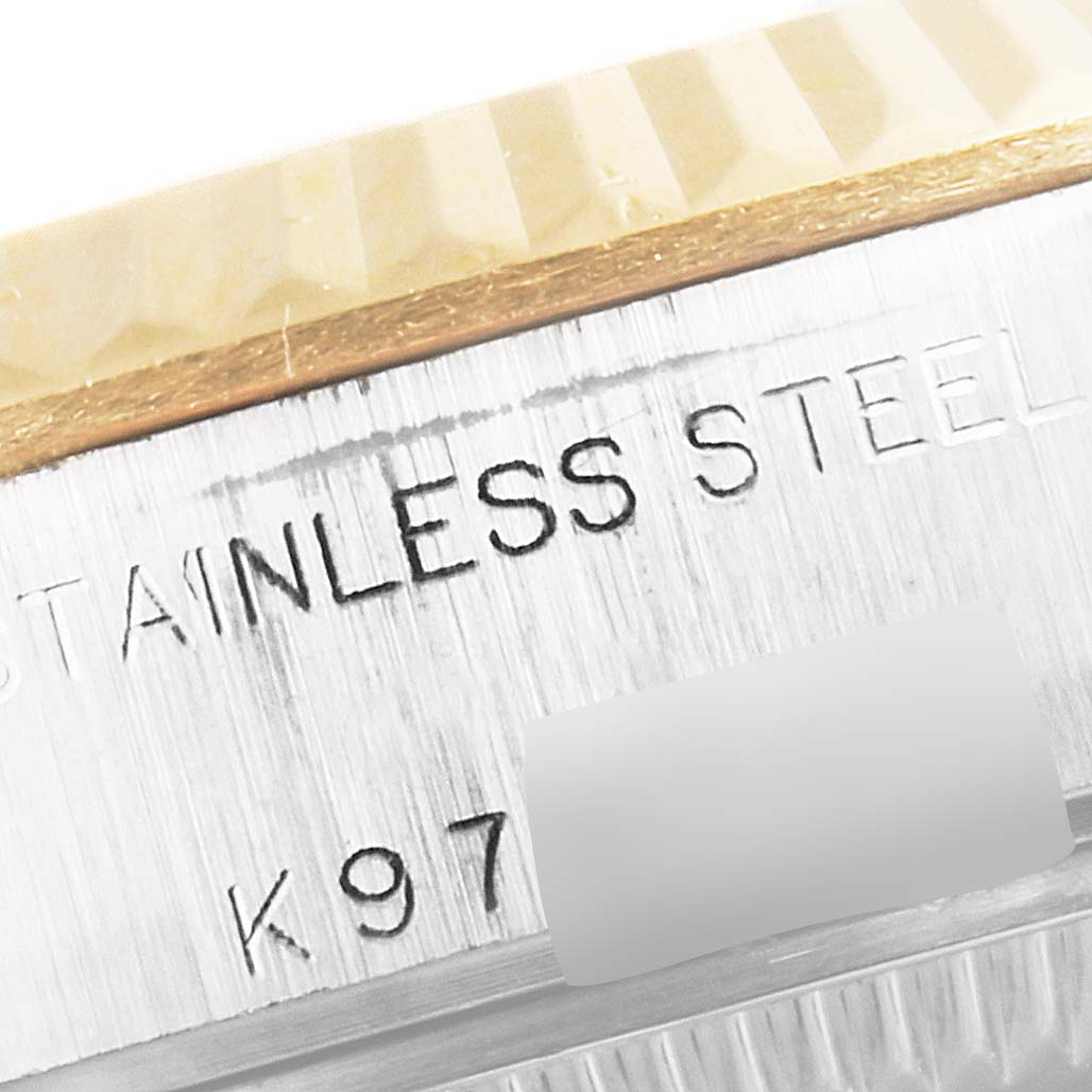 This close-up image shows the side of the stainless steel casing and bezel for the Rolex Datejust 79173 Women's Steel and Gold (two tone) Beige Dial 79173 Women's Steel and Gold (two tone) Beige Dial watch.