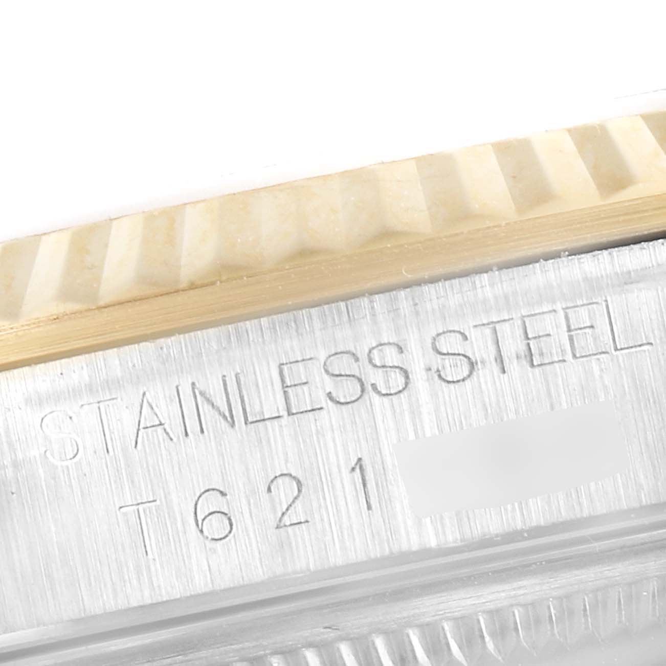 This close-up image shows the engraved stainless steel case and bezel of a Rolex Datejust 16233 Men's Steel and Gold (two tone) Blue Dial 16233 Men's Steel and Gold (two tone) Blue Dial watch.