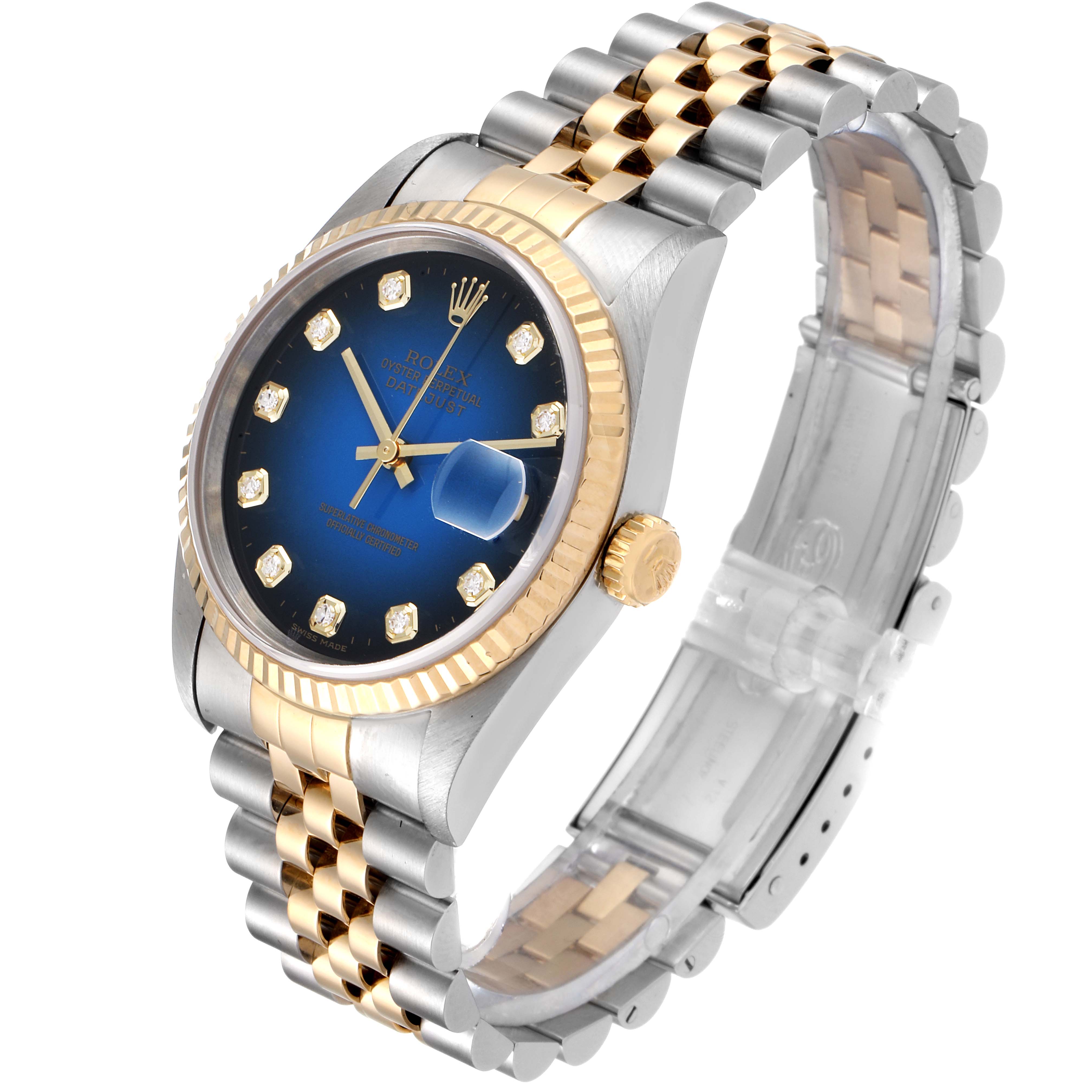 The image shows a Rolex Datejust 16233 Men's Steel and Gold (two tone) Blue Dial 16233 Men's Steel and Gold (two tone) Blue Dial watch at a slight angle, highlighting its blue dial, fluted bezel, and two-tone jubilee bracelet.