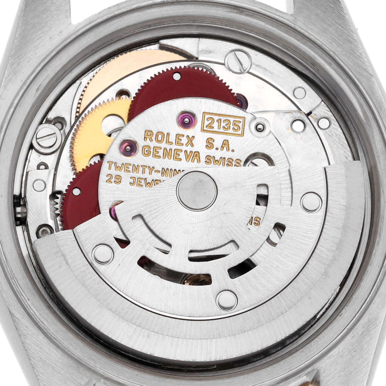 The image shows the movement mechanism of a Rolex Datejust 69173 Women's Steel and Gold (two tone) White Dial 69173 Women's Steel and Gold (two tone) White Dial, viewed from the back, highlighting gears and inscriptions.