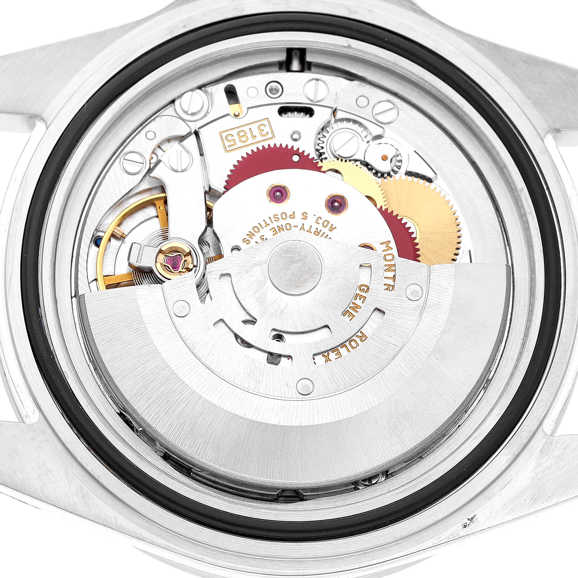 The image shows the internal mechanism of a Rolex Explorer 16570 Men's Stainless Steel White Dial watch from a top-down angle, highlighting its gears and rotor.