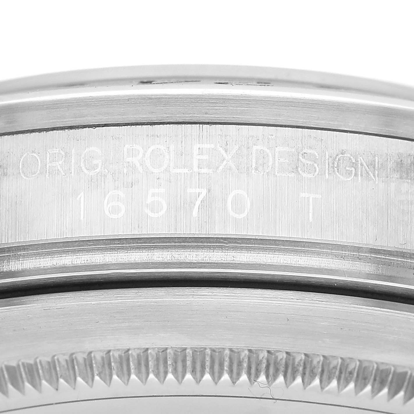 The image shows a close-up of the side edge of the Rolex Explorer 16570 Men's Stainless Steel White Dial, highlighting the "ORIG ROLEX DESIGN 16570 T" engraving.