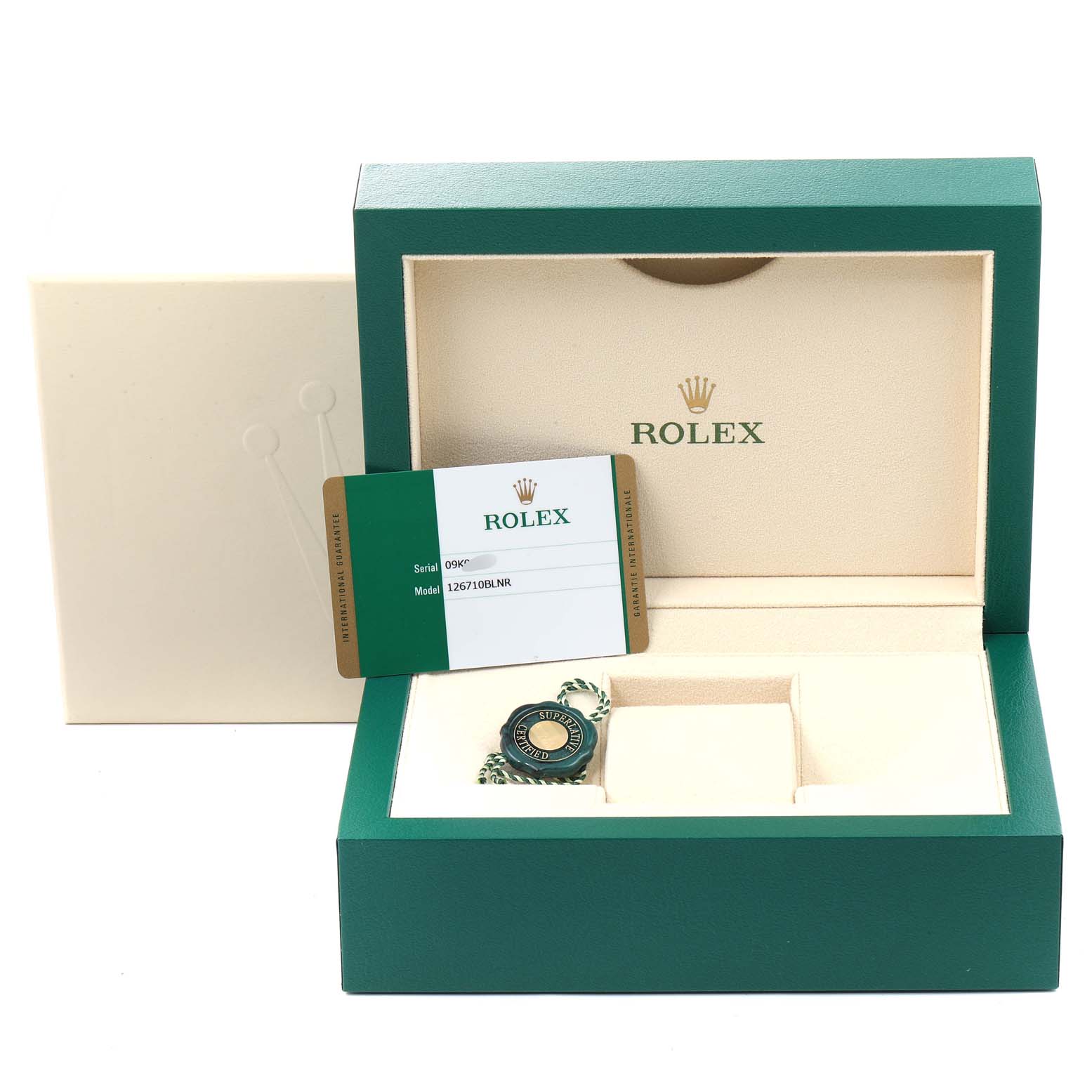 The image shows an open Rolex box for the GMT-Master model with a warranty card and a tag.