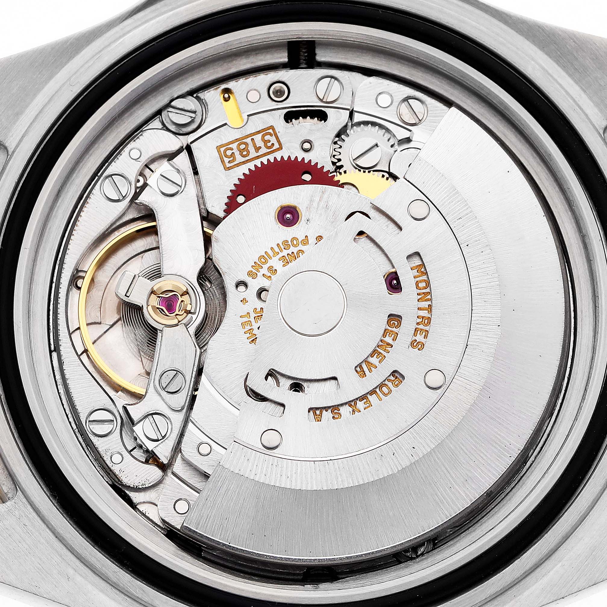 The image shows the movement of a Rolex GMT-Master 16713 Men's Steel and Gold (two tone) Black Dial watch from a top-down angle, highlighting the gears and rotor.