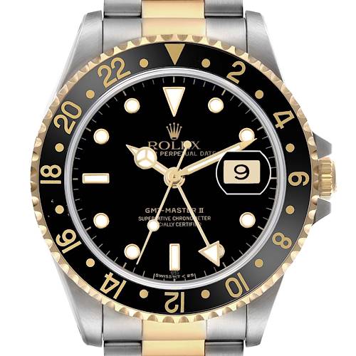 The image shows a front view of the Rolex GMT-Master 16713 Men's Steel and Gold (two tone) Black Dial II with a two-tone bezel, black dial, and gold markers.
