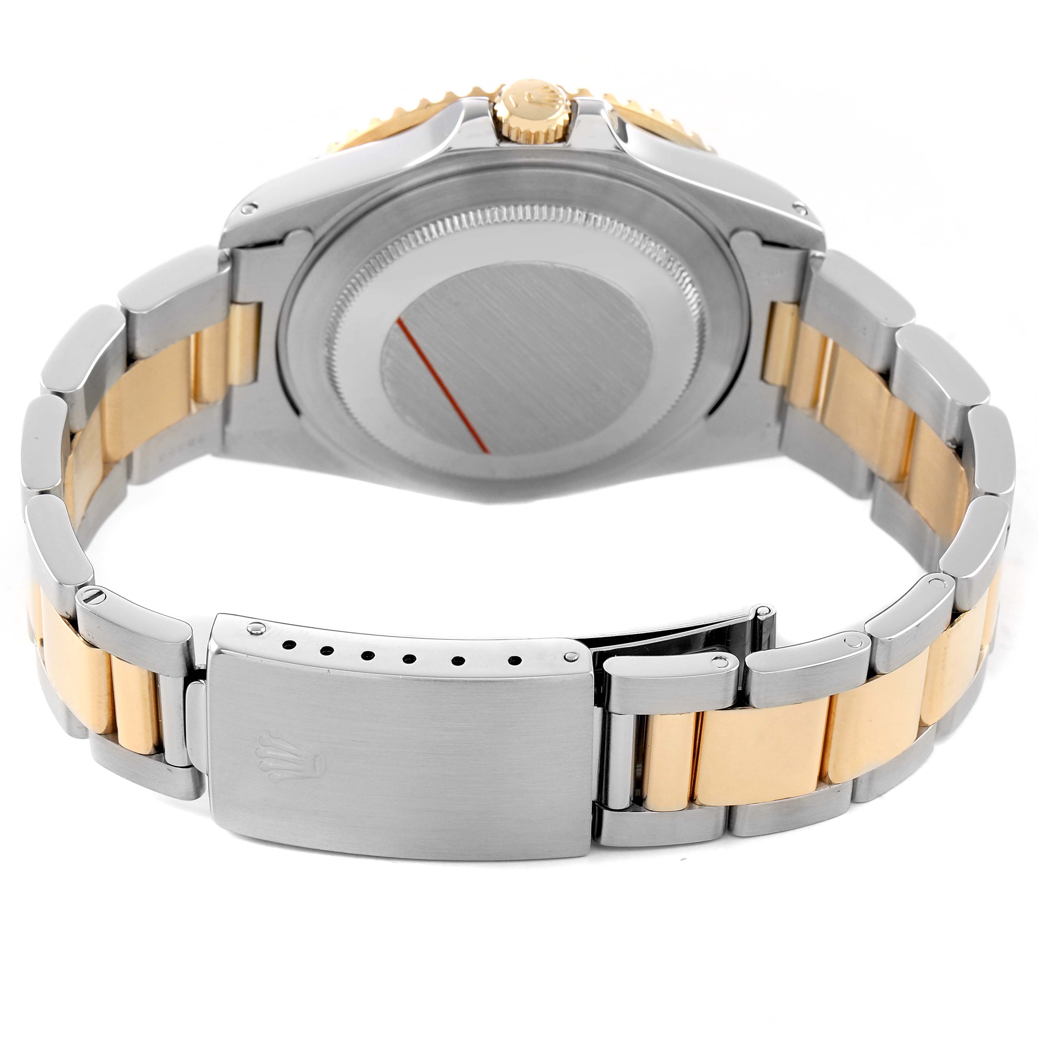 The Rolex GMT-Master 16713 Men's Steel and Gold (two tone) Black Dial watch is shown from the back, highlighting the case back, clasp, and two-tone bracelet.