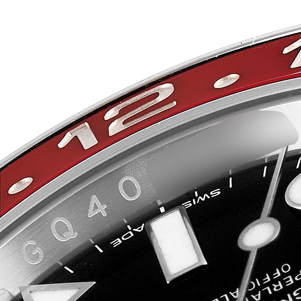 The image shows a close-up of the bezel and partial dial of a Rolex GMT-Master 116719 Men's White Gold Black Dial 116719 Men's White Gold Black Dial watch.