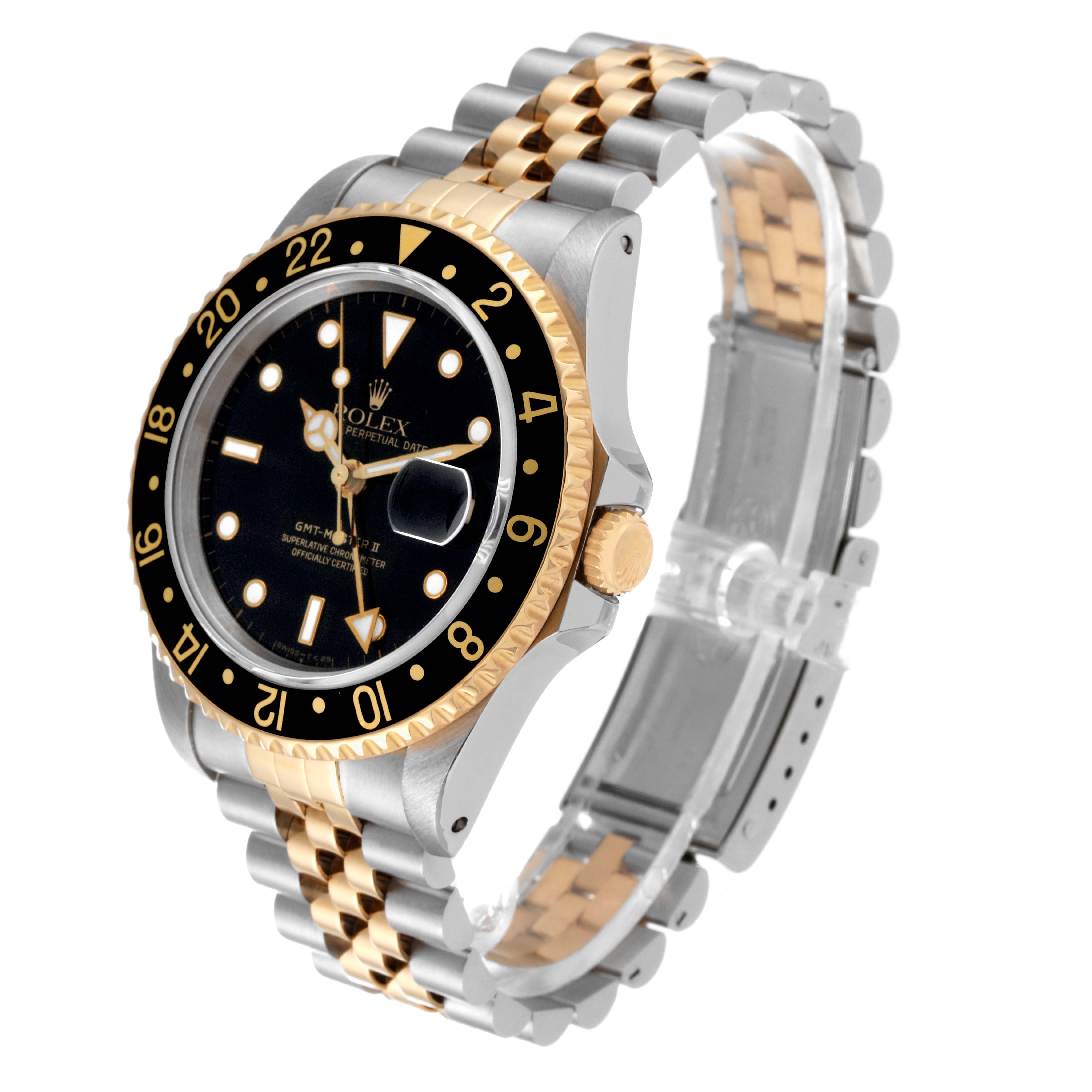 The Rolex GMT-Master 16713 Men's Steel and Gold (two tone) Black Dial 16713 Men's Steel and Gold (two tone) Black Dial is shown at a three-quarter angle, highlighting its two-tone bezel, dial, crown, and bracelet.