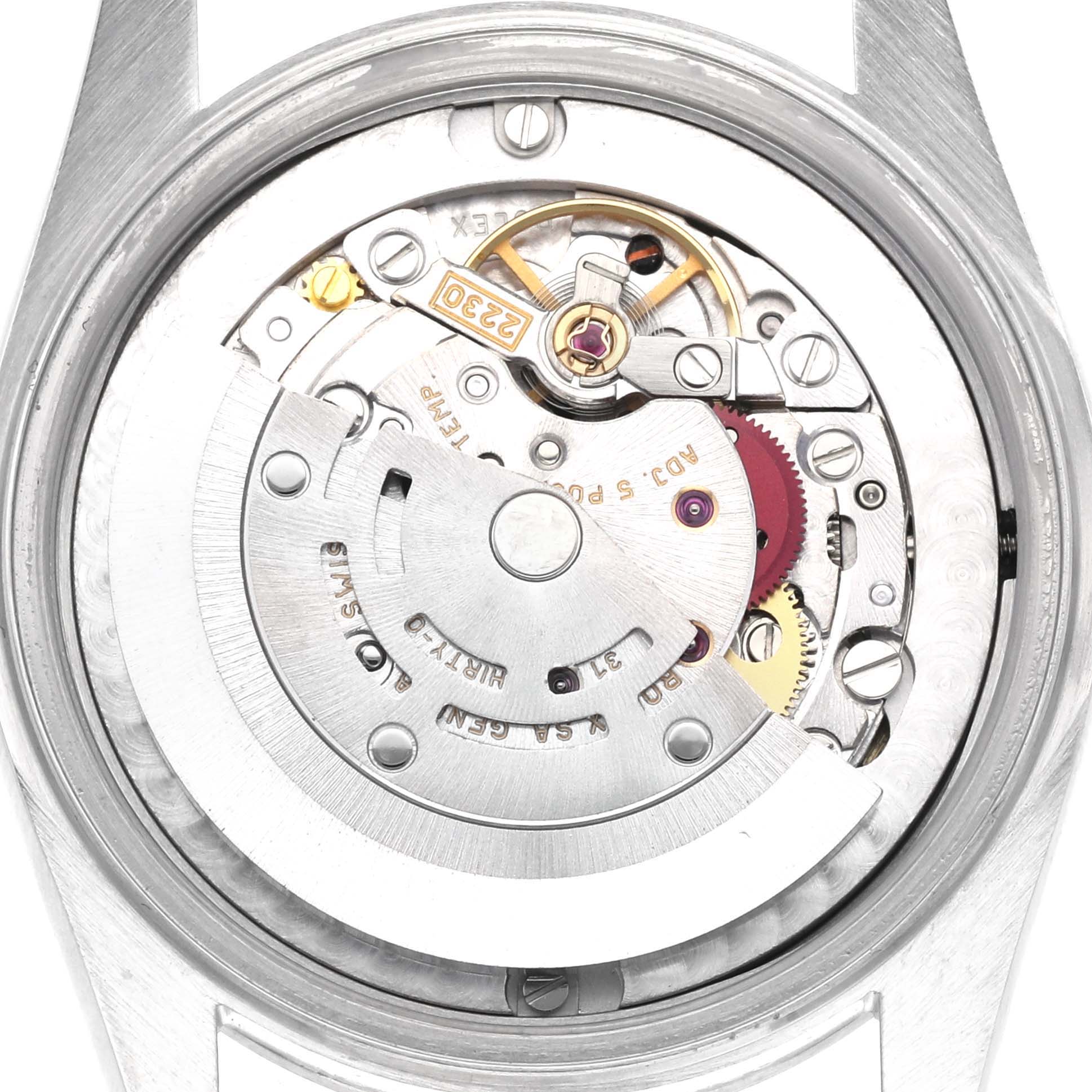 The image shows the movement mechanism of a Mid-Size Rolex watch from the back.