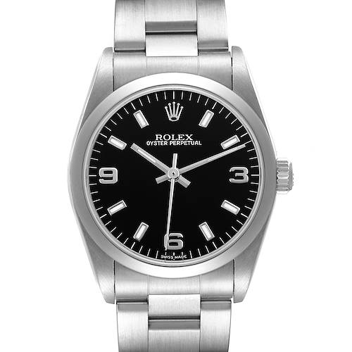 The Rolex Oyster Perpetual Mid-Size is shown from a front angle, displaying the black dial, markers, and stainless steel bracelet.