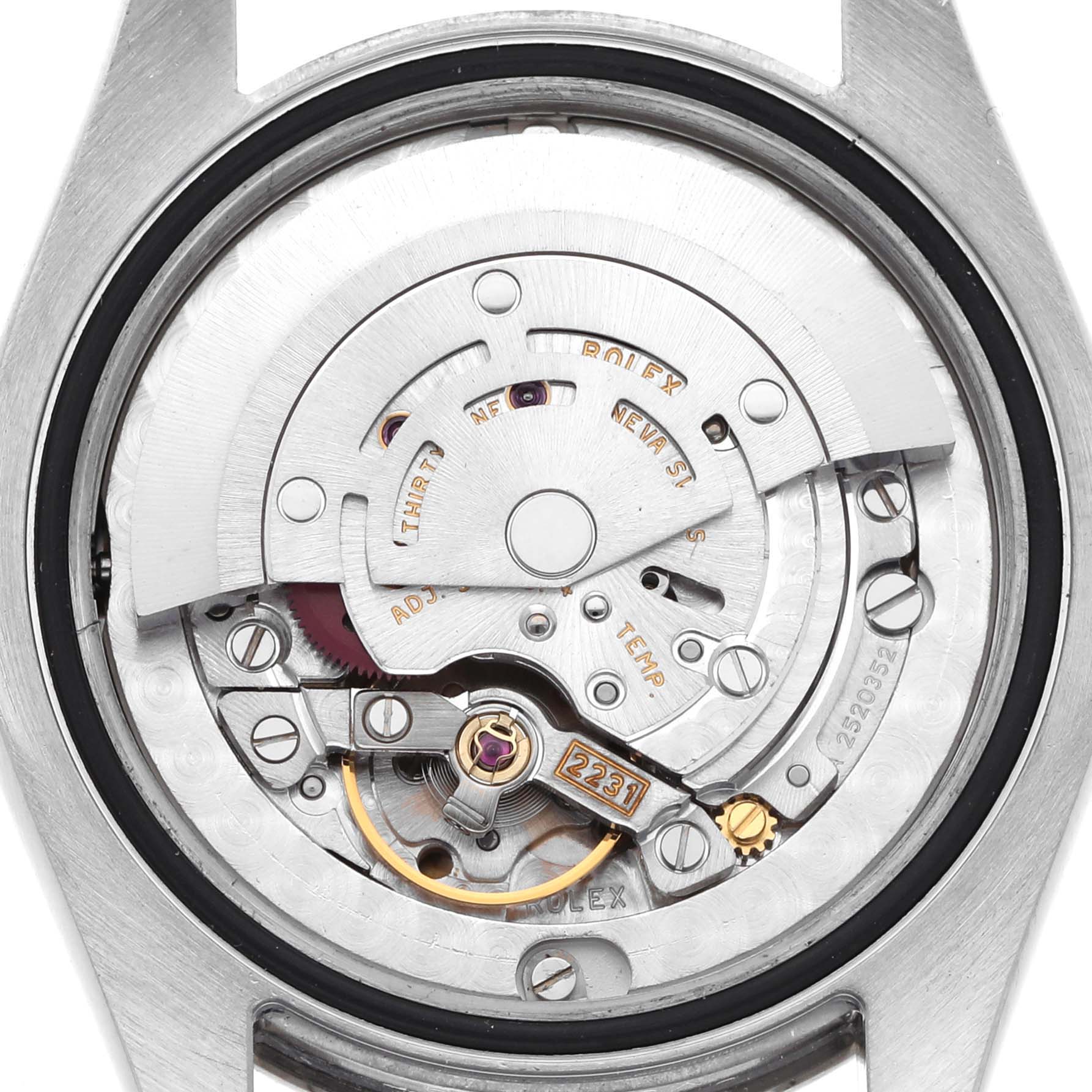 The image shows the movement mechanism of a Mid-Size Rolex watch from the back.