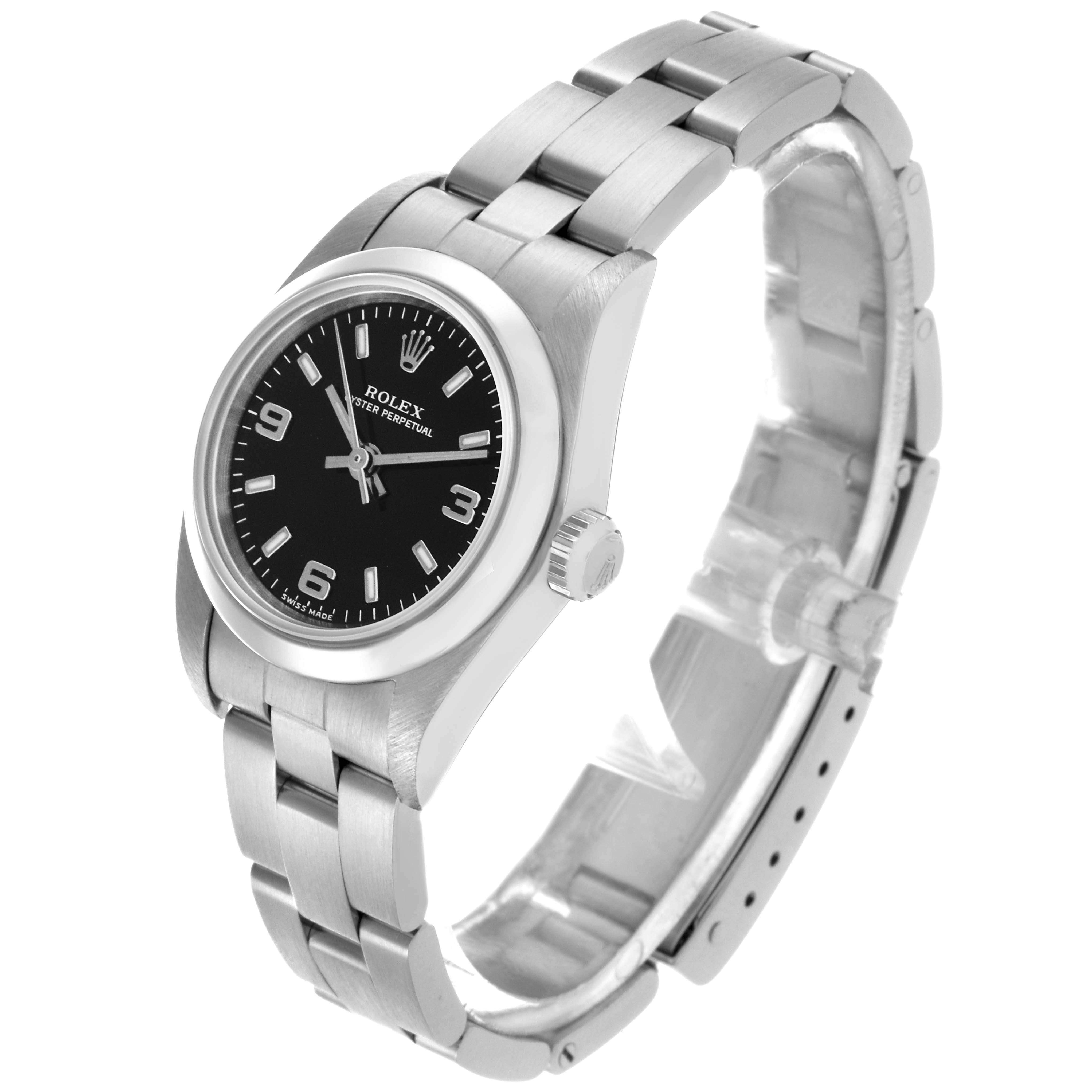 The Rolex Oyster Perpetual 76080 Women's Stainless Steel Black Dial 76080 Women's Stainless Steel Black Dial watch is shown at a three-quarter angle, highlighting the face, bezel, and bracelet.