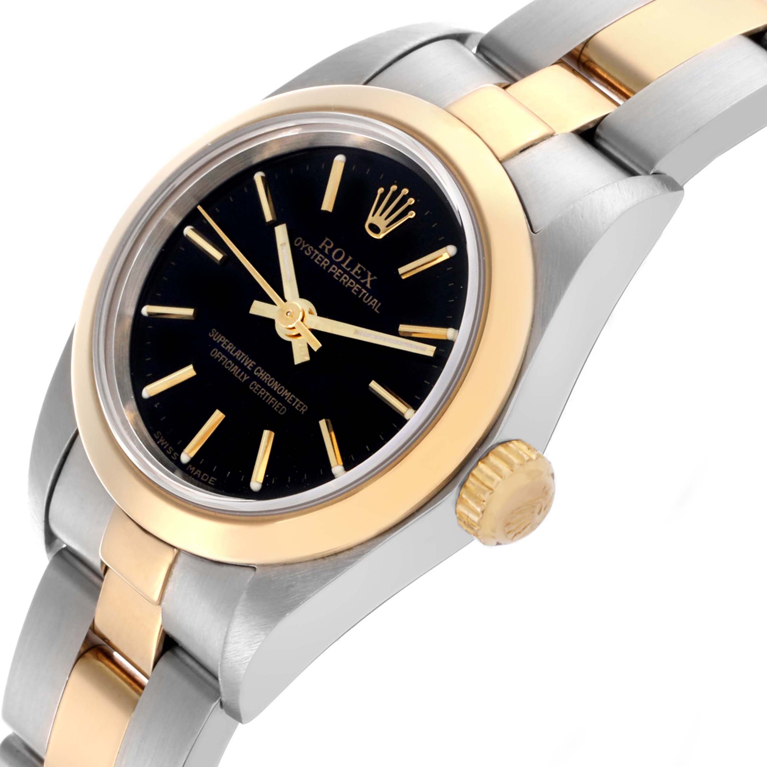 The image shows a Rolex Datejust 76183 Women's Steel and Gold (two tone) Black Dial 76183 Women's Steel and Gold (two tone) Black Dial watch at an angle highlighting the dial, bezel, crown, and part of the bracelet.