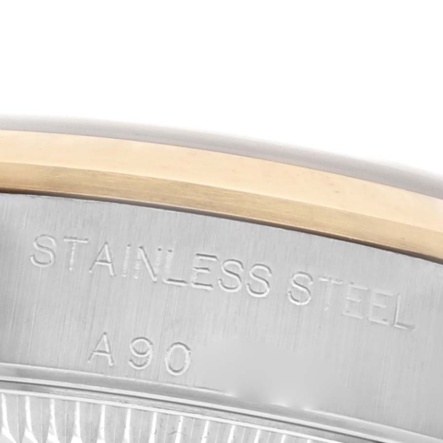 The image shows a close-up of the case side of a Rolex Datejust 76183 Women's Steel and Gold (two tone) Black Dial 76183 Women's Steel and Gold (two tone) Black Dial, highlighting the stainless steel and gold materials.