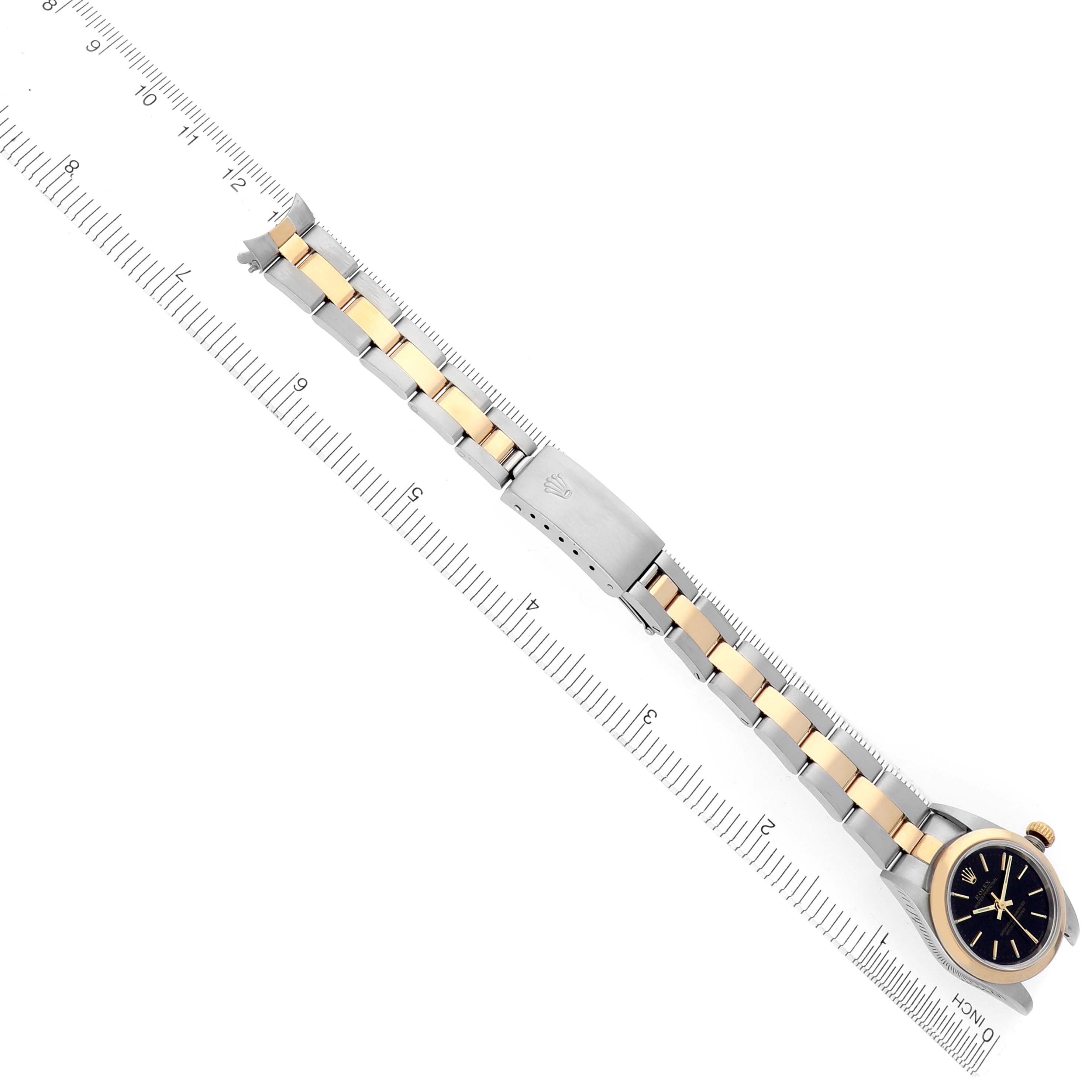 The Rolex Datejust 76183 Women's Steel and Gold (two tone) Black Dial 76183 Women's Steel and Gold (two tone) Black Dial watch is shown from an overhead angle, displaying the face, full bracelet, and clasp.