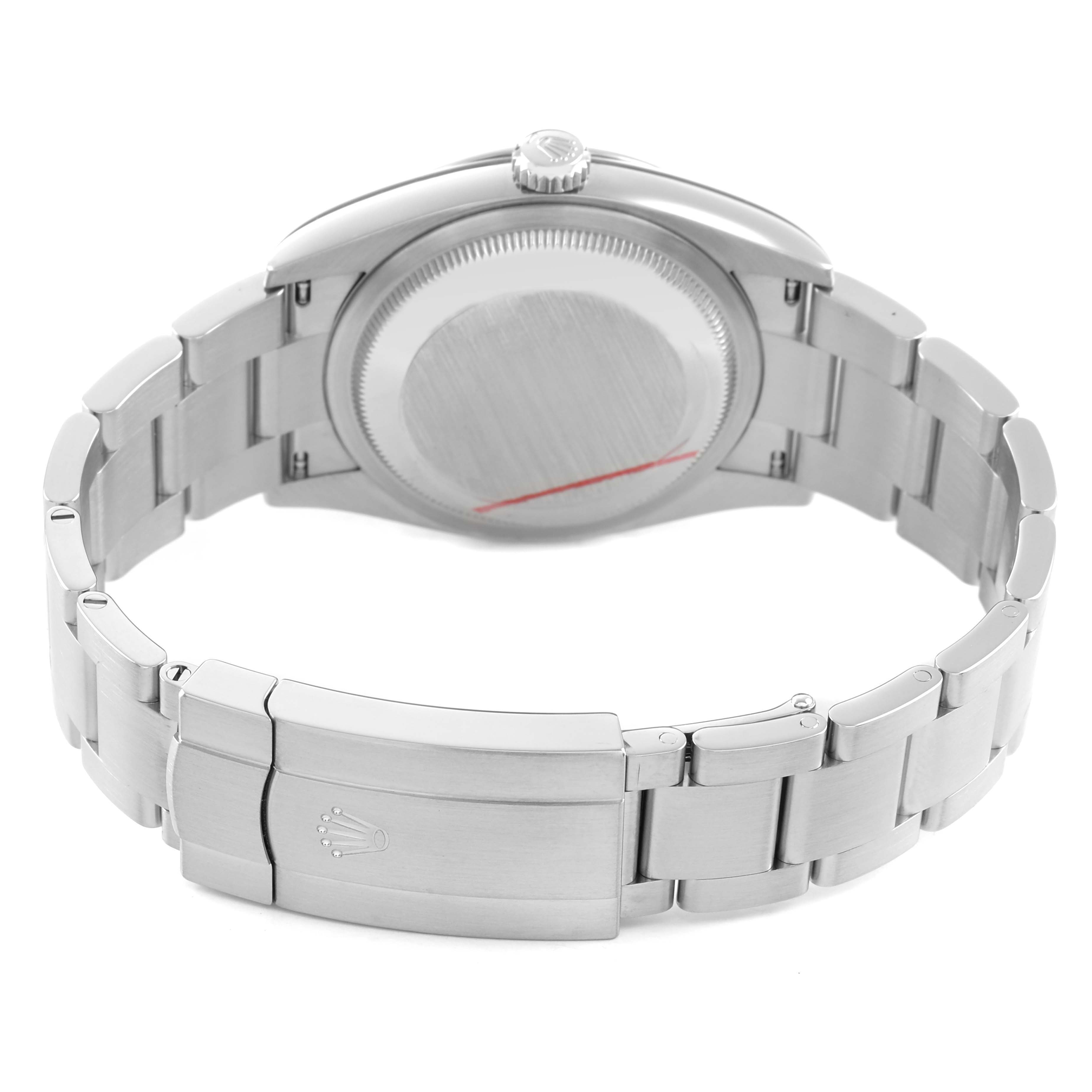 The image shows the back view of a Rolex Oyster Perpetual 126000 Men's Stainless Steel Black Dial watch, highlighting the case back and bracelet clasp.